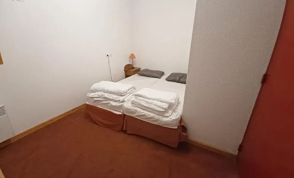 Bedroom, Bed in Vacancéole - Résidence Les Chalets de la Ramoure Bedroom, Bed in Vacancéole - Résidence Les Chalets de la Ramoure