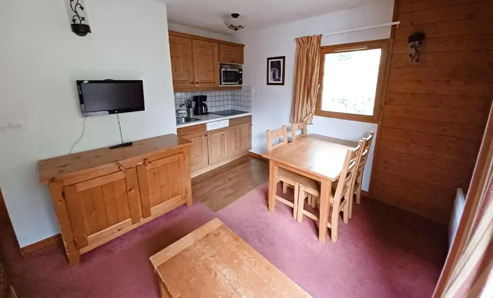 Living room in Vacancéole - Résidence Les Chalets de la Ramoure Living room in Vacancéole - Résidence Les Chalets de la Ramoure