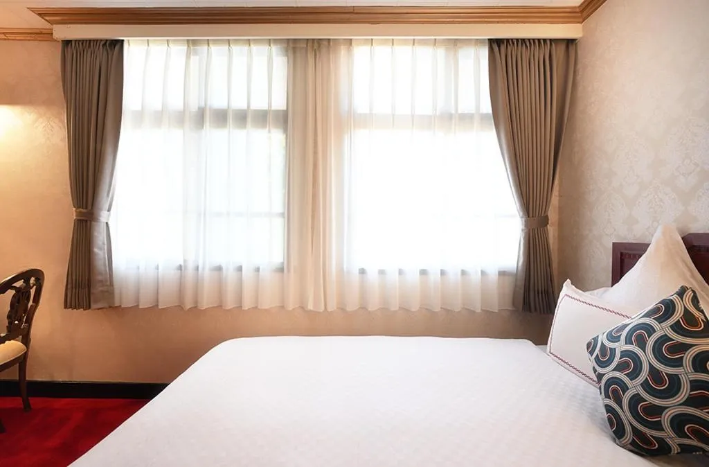 Bed in Alishan Hotel