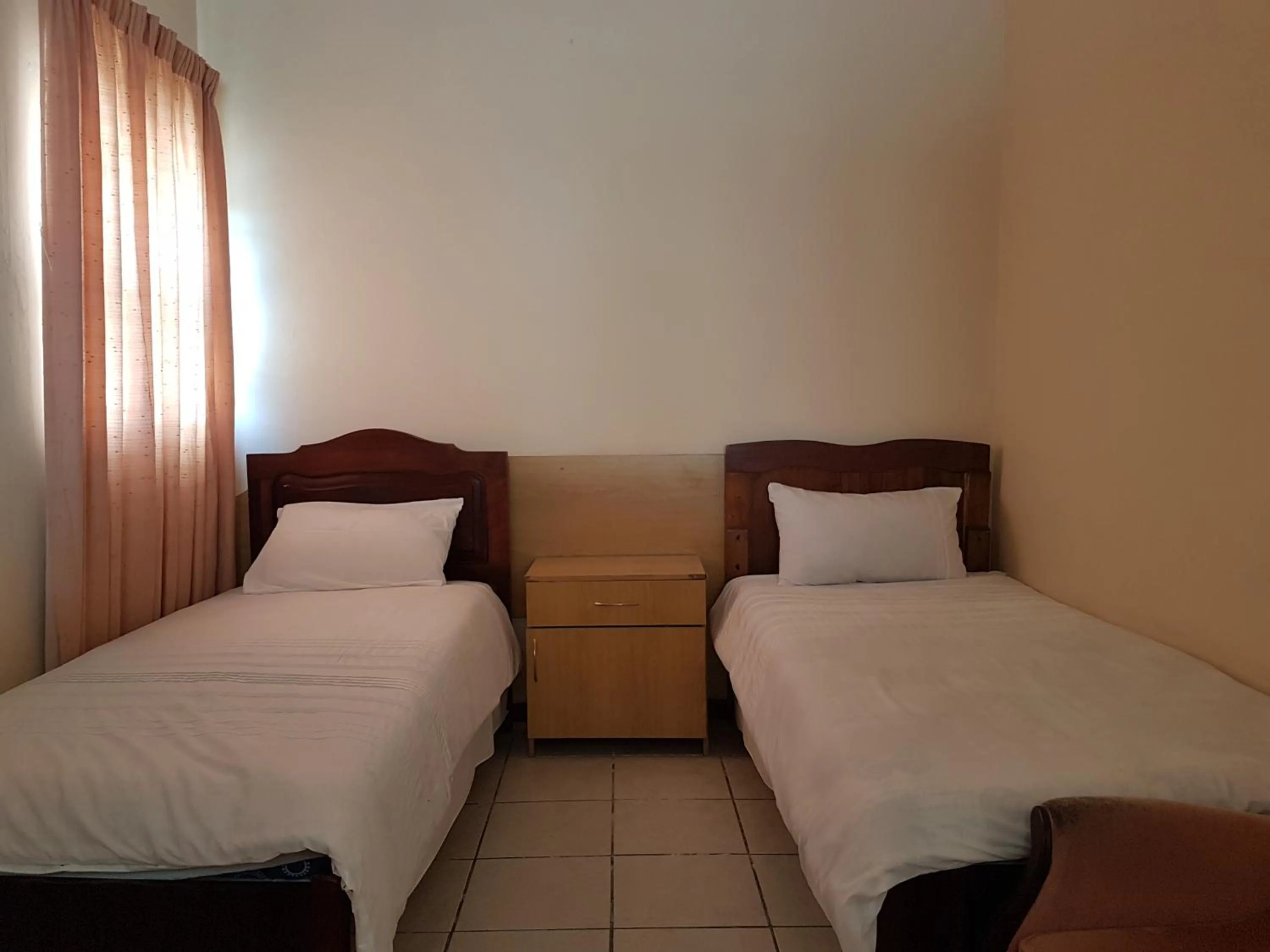 Bed in Stone Crescent Hotel