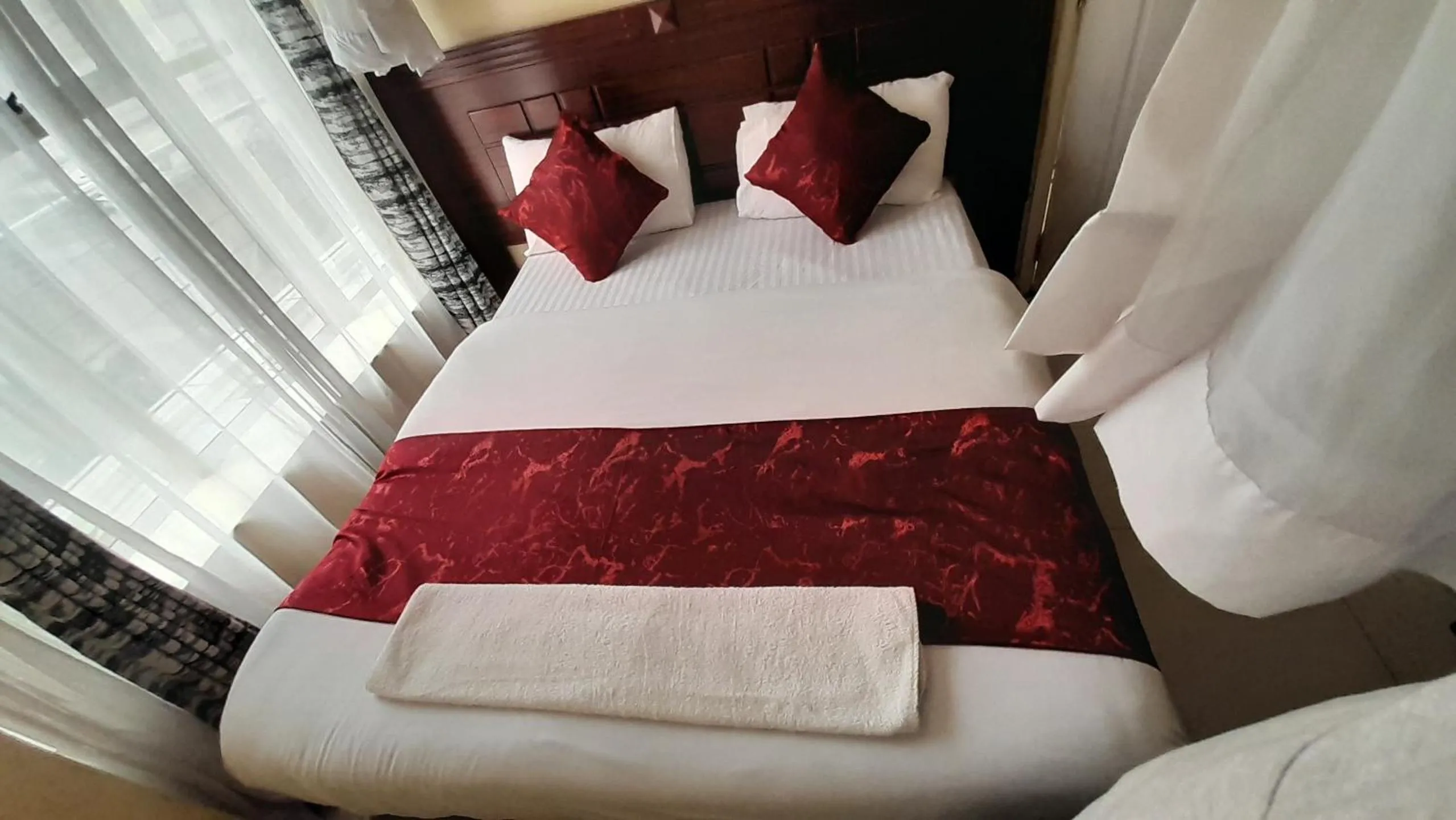 Bed in Epitome Times Hotel