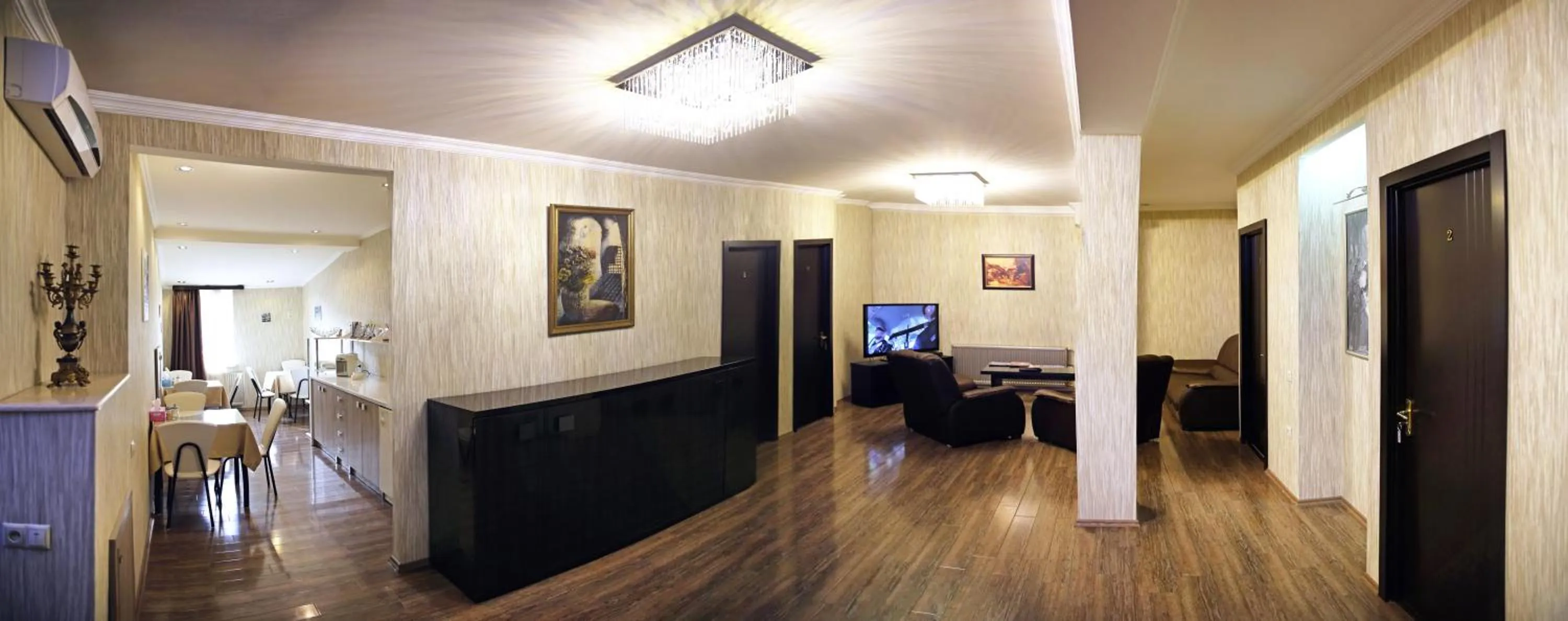 Communal lounge/ TV room in Rondo Hotel