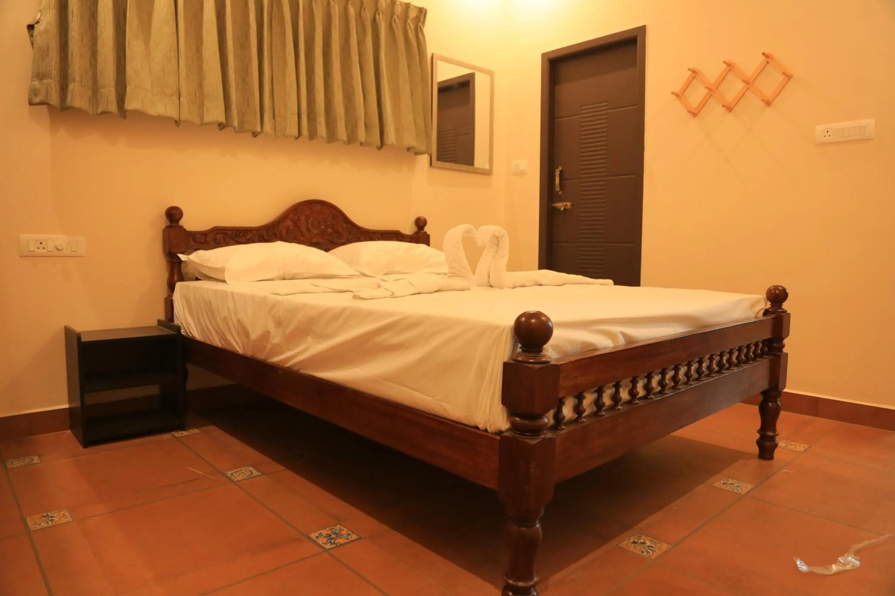 Photo of the whole room, Bed in Ponni Homestay Kumbakonam