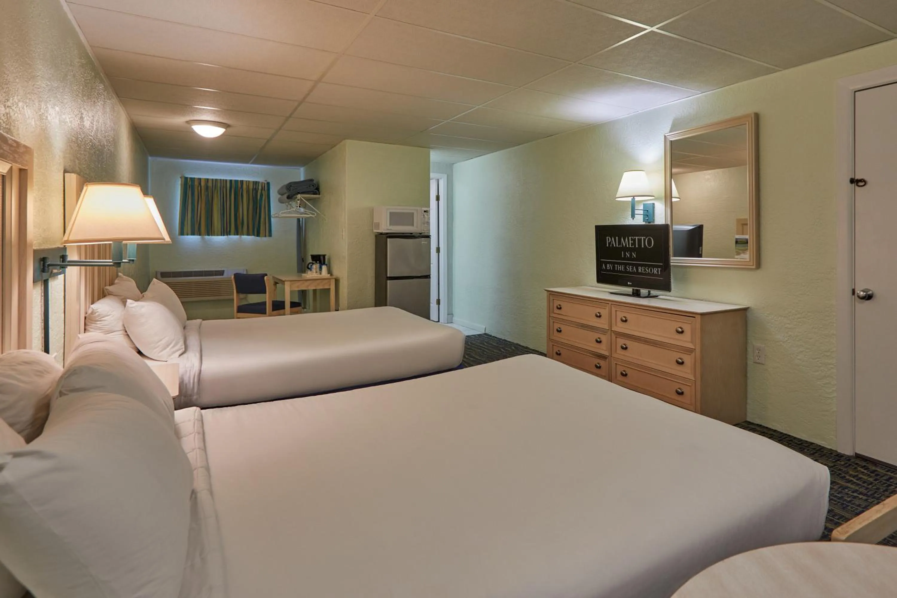 Bed in Palmetto Beachfront Hotel, a By The Sea Resort