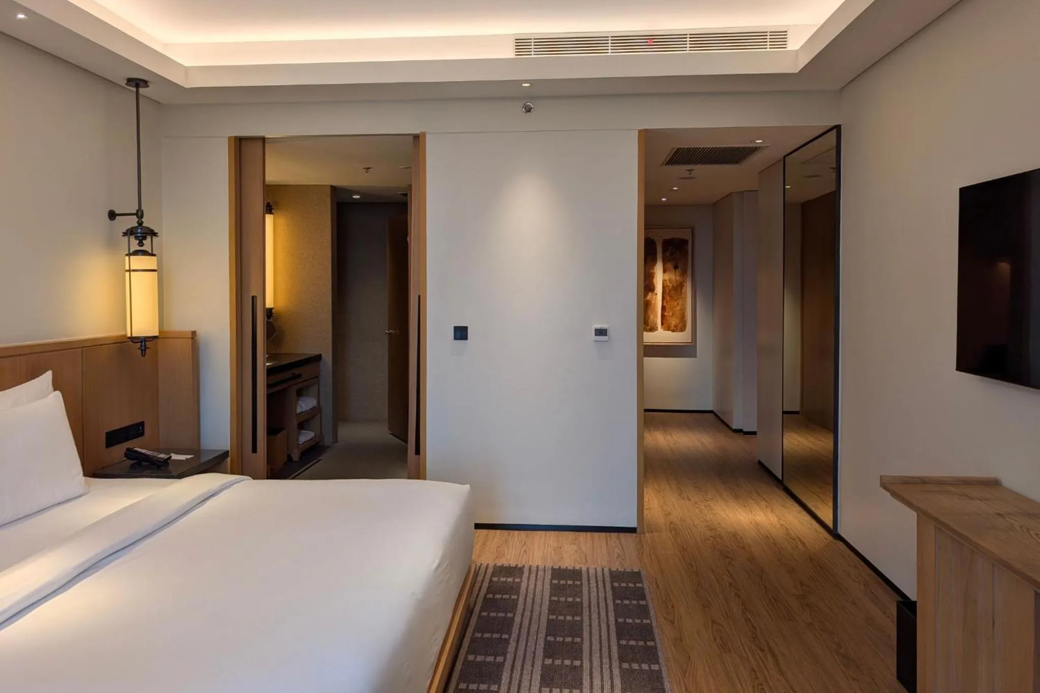 Living room, Bed in Hotel Tentrem Jakarta