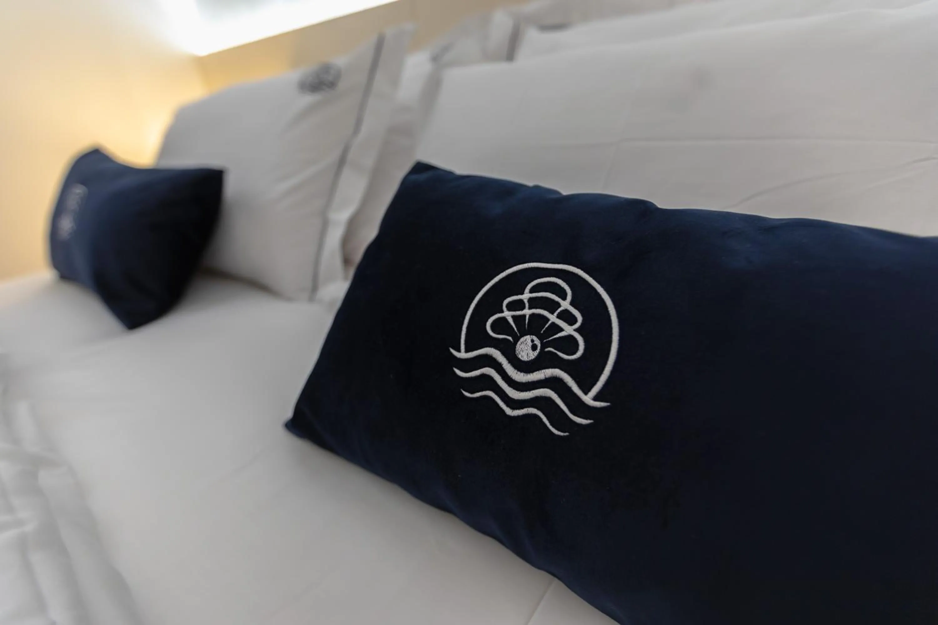 Bed in Blue Pearl Elite Apartments