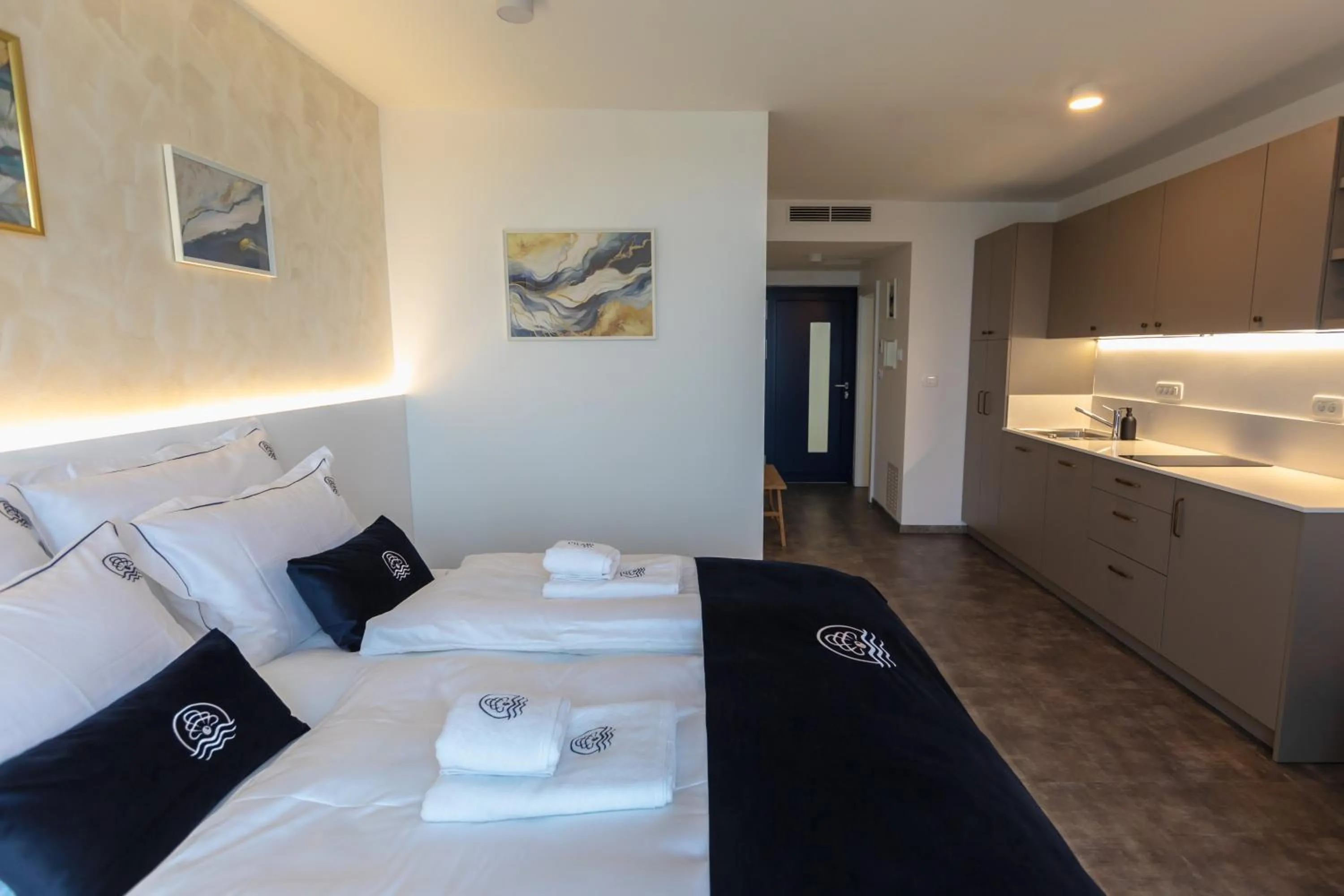 Bed in Blue Pearl Elite Apartments