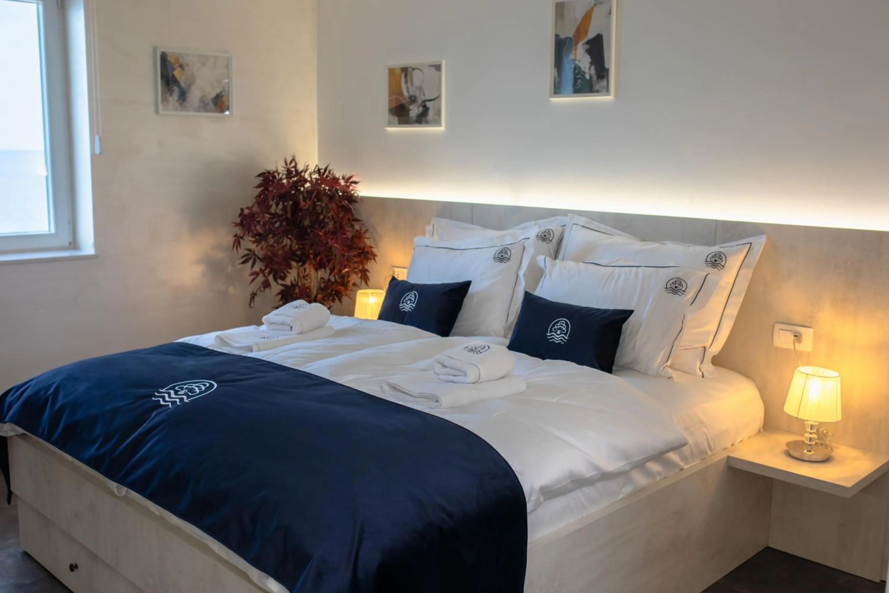 Bed in Blue Pearl Elite Apartments