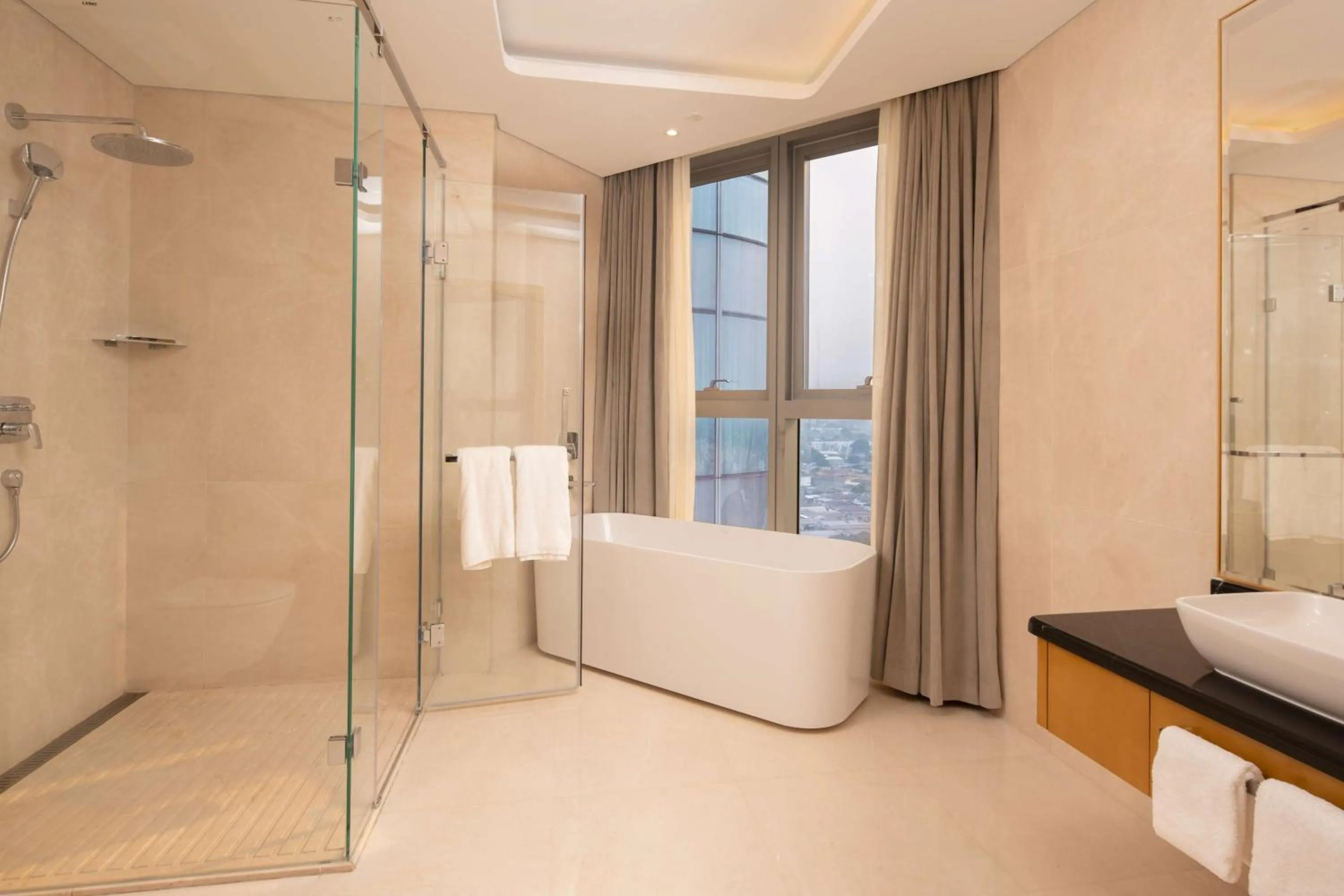 Bathroom in Hilton Brazzaville Les Tours Jumelles Hotel & Residences
