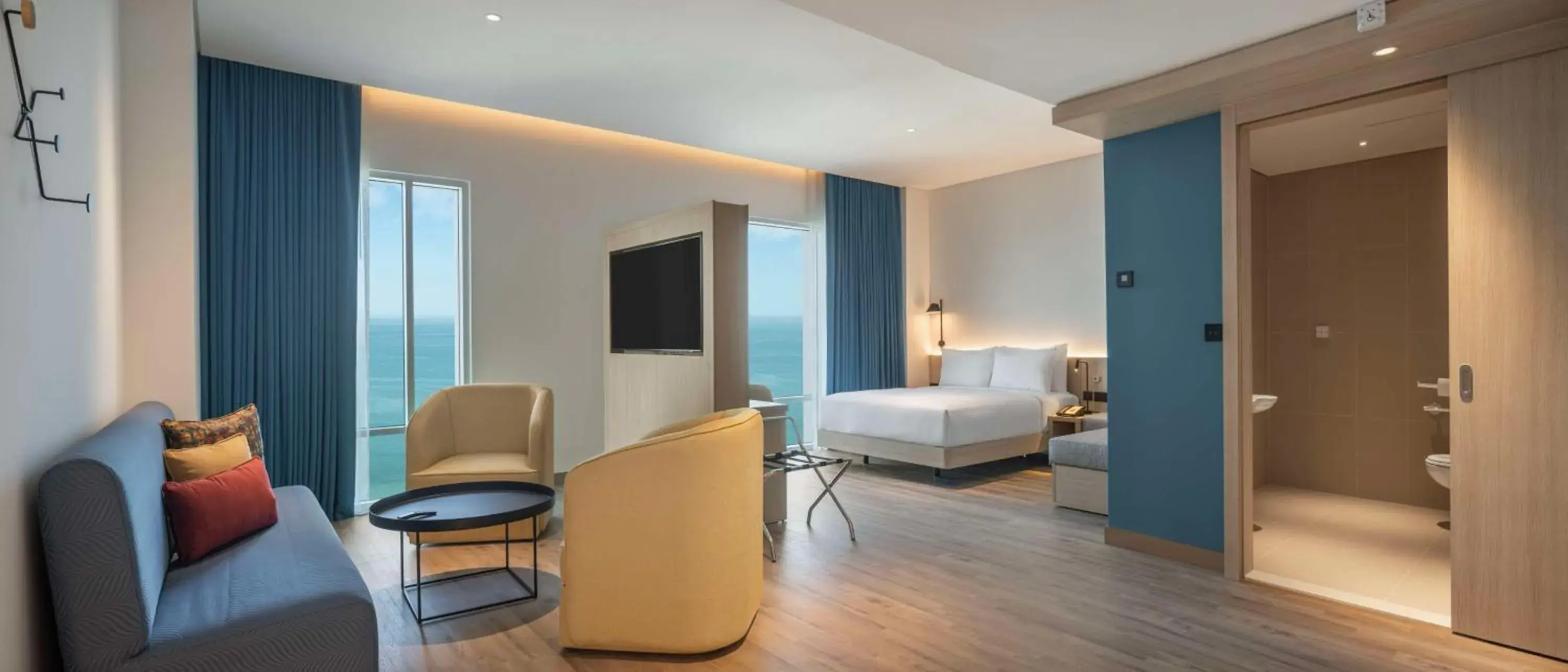 Living room, Bed in Hampton By Hilton Kuwait Salmiya Living room, Bed in Hampton By Hilton Kuwait Salmiya