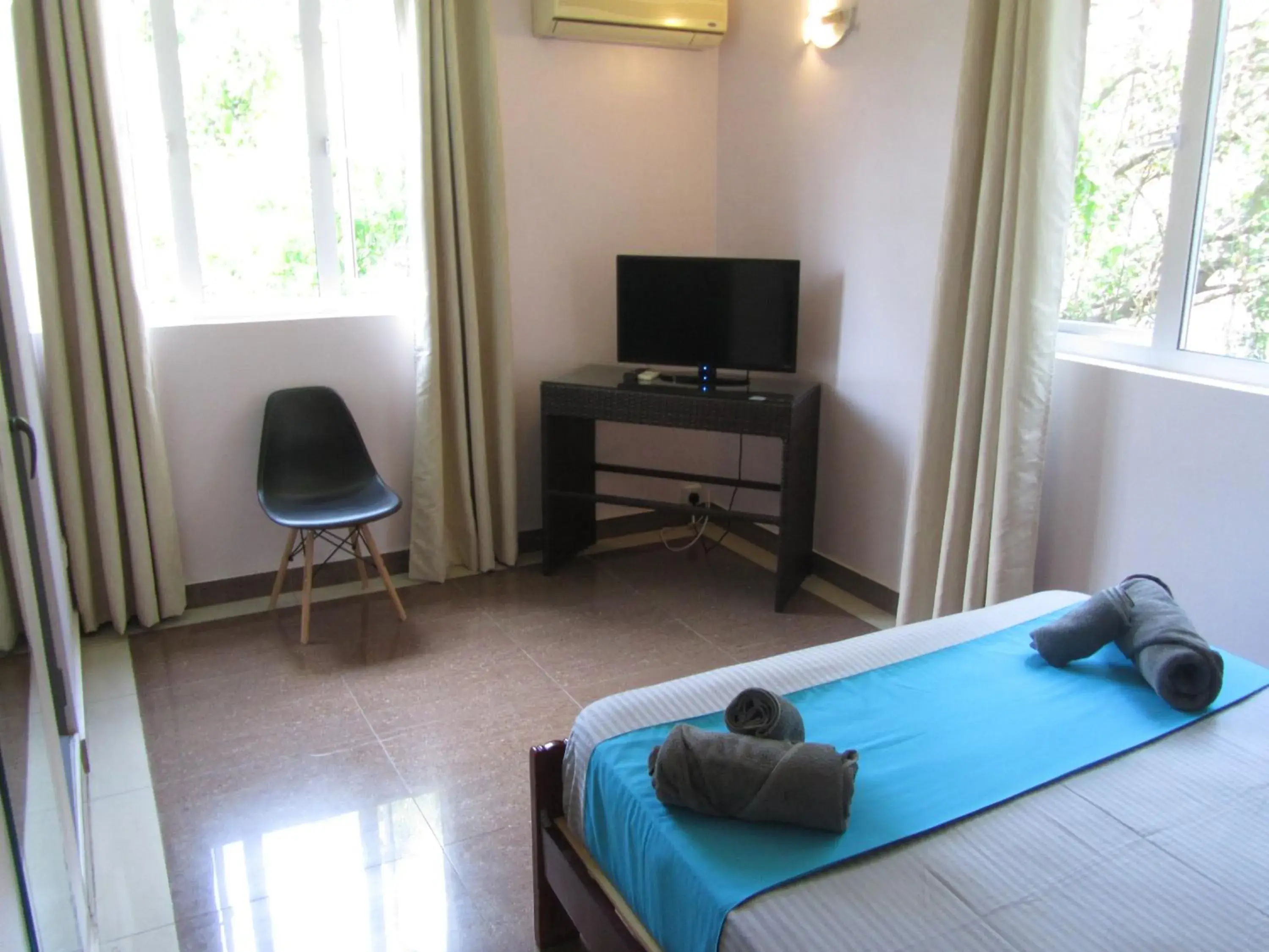 Bed, TV/Entertainment Center in Lariad BnB