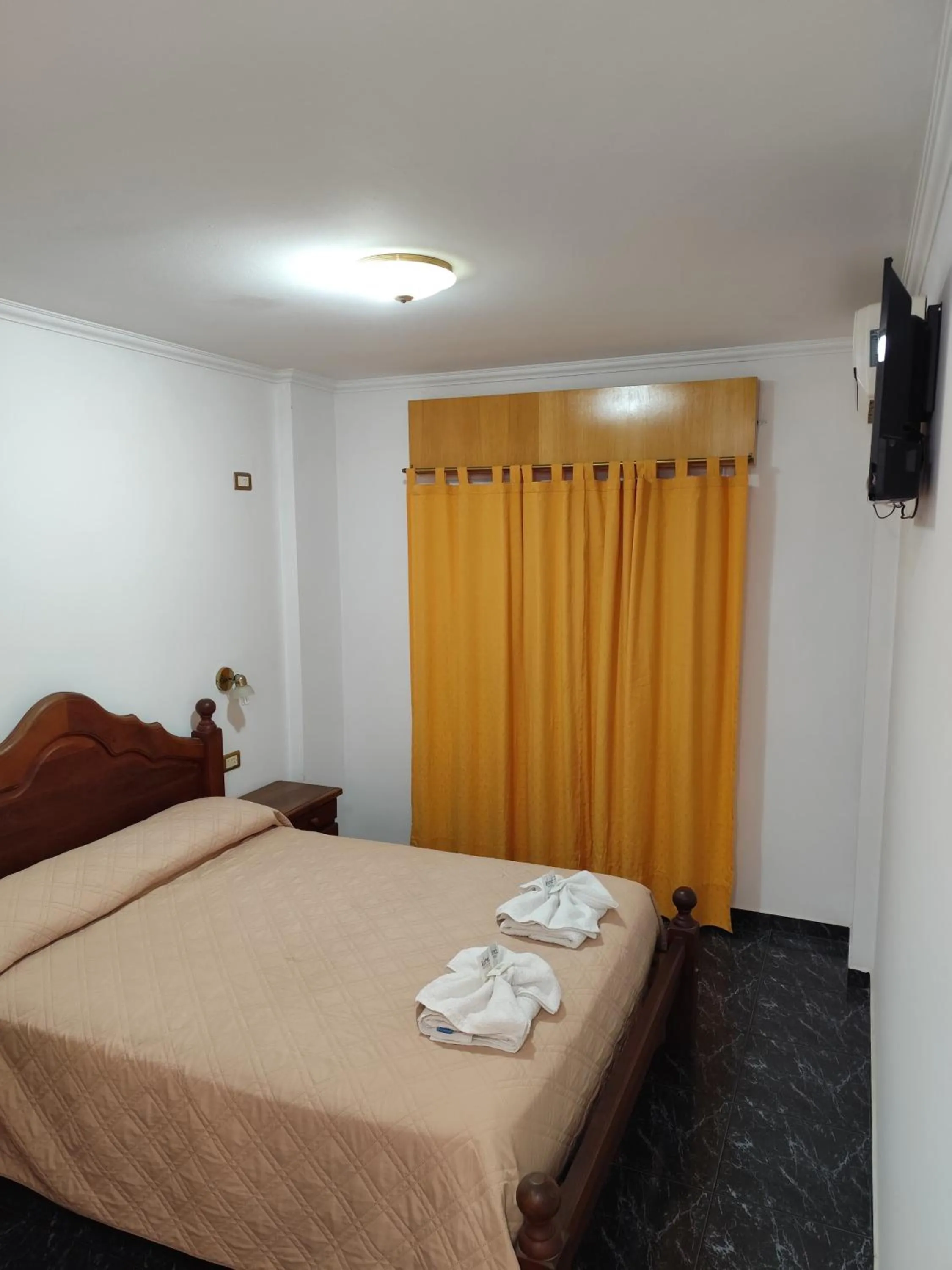 Bed in Victor Hotel