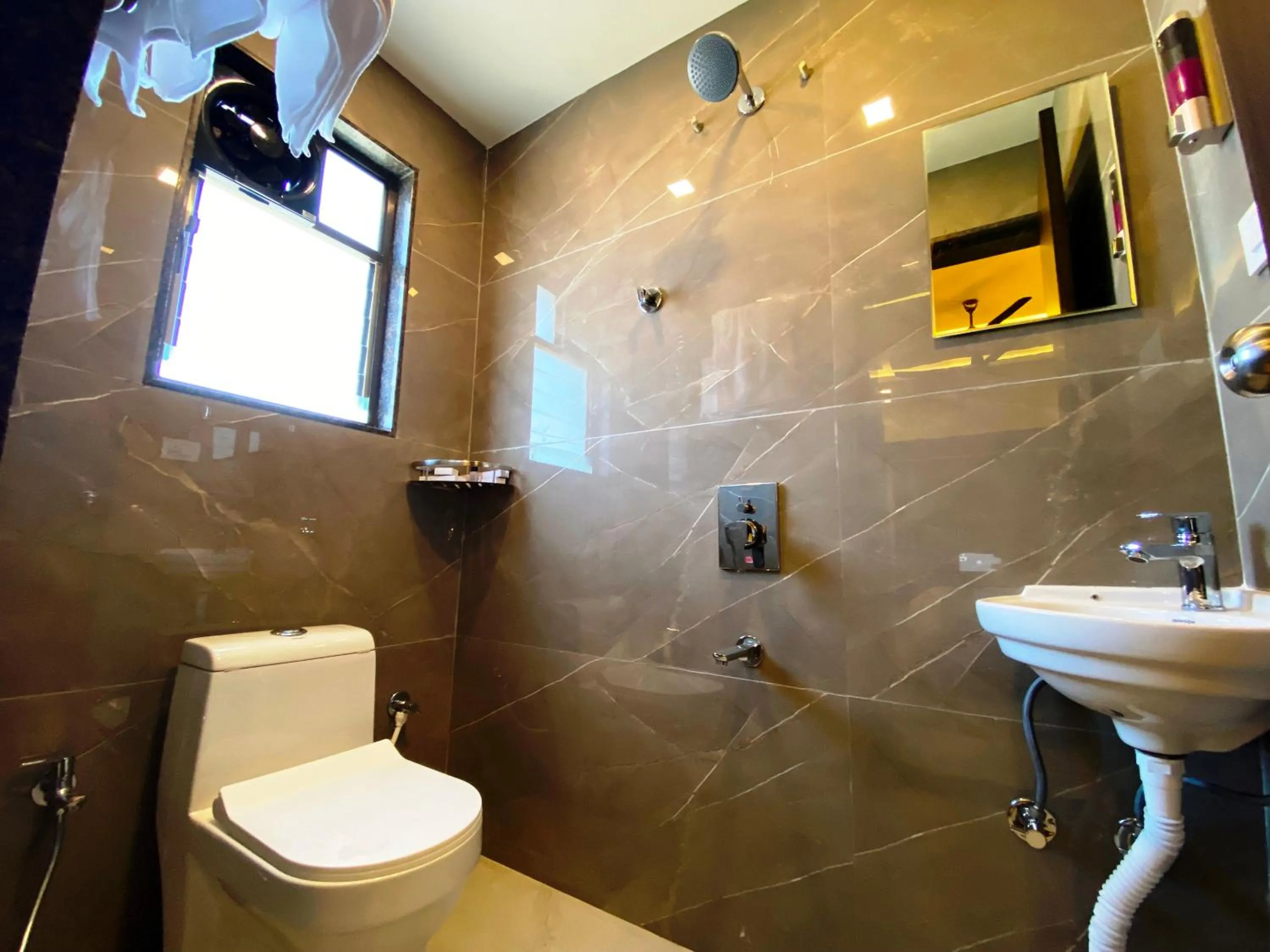 Bathroom in The Grand Sarovar Inn And Suites