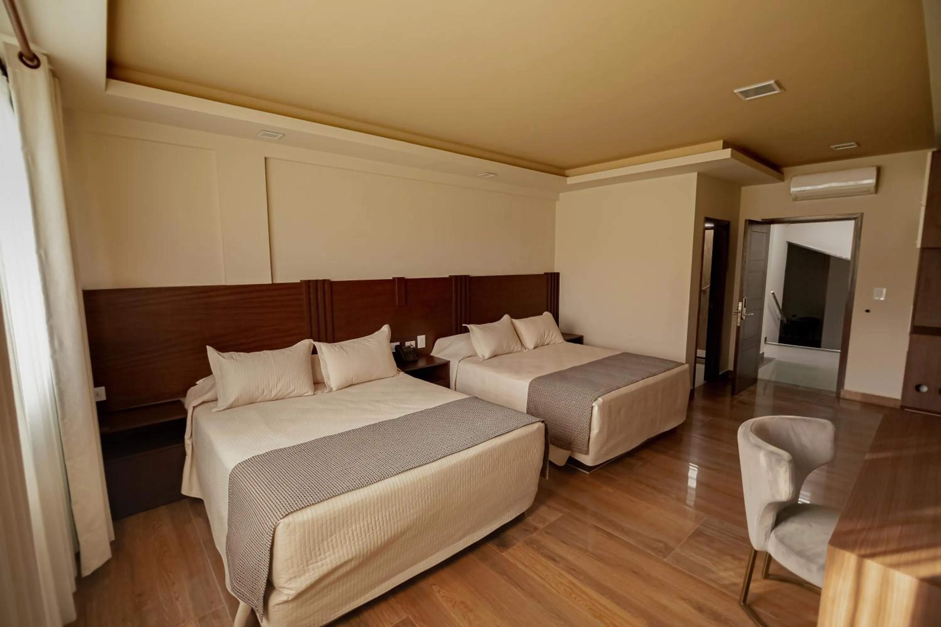 Photo of the whole room, Bed in Hotel Sirari By Regina