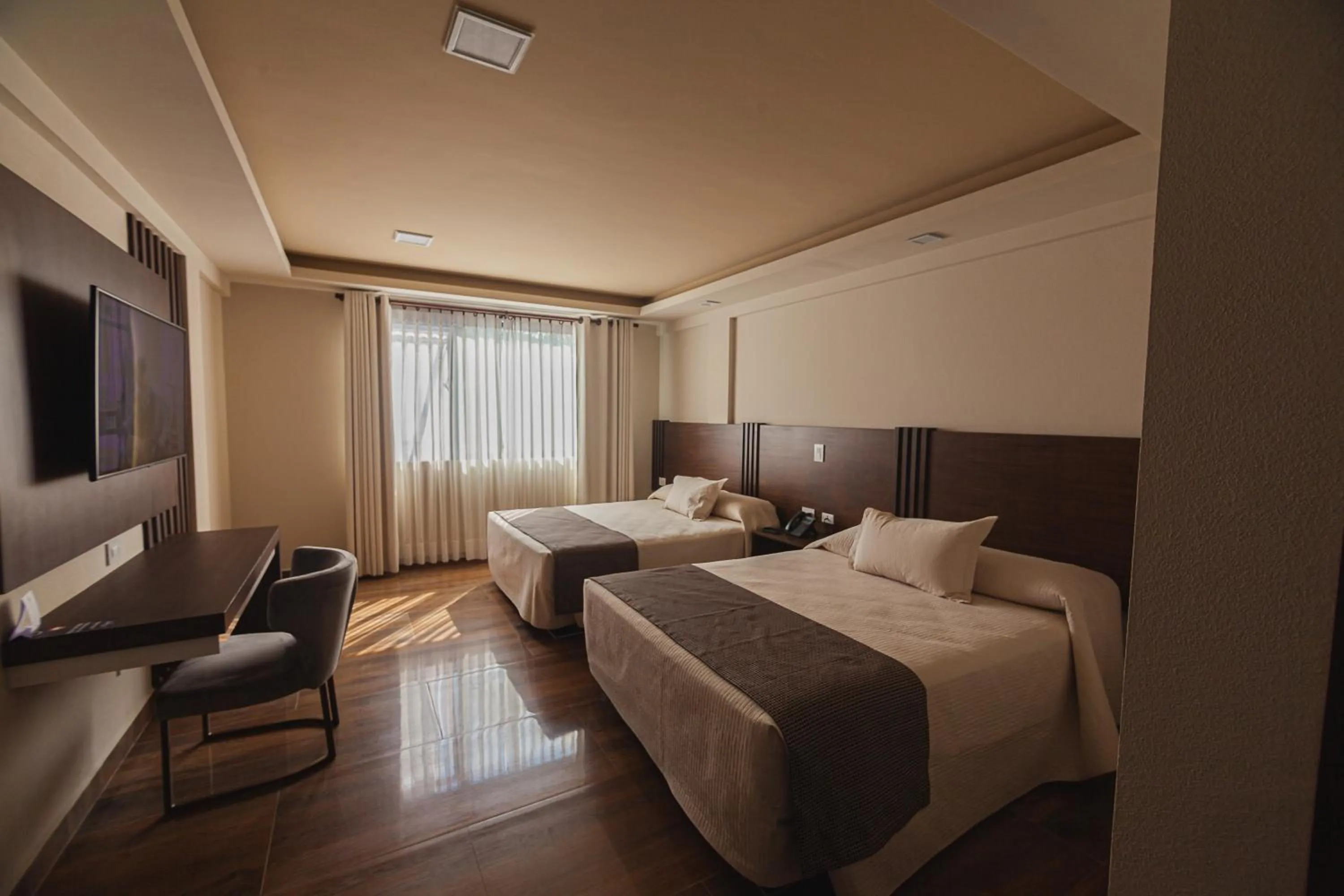 Photo of the whole room, Bed in Hotel Sirari By Regina