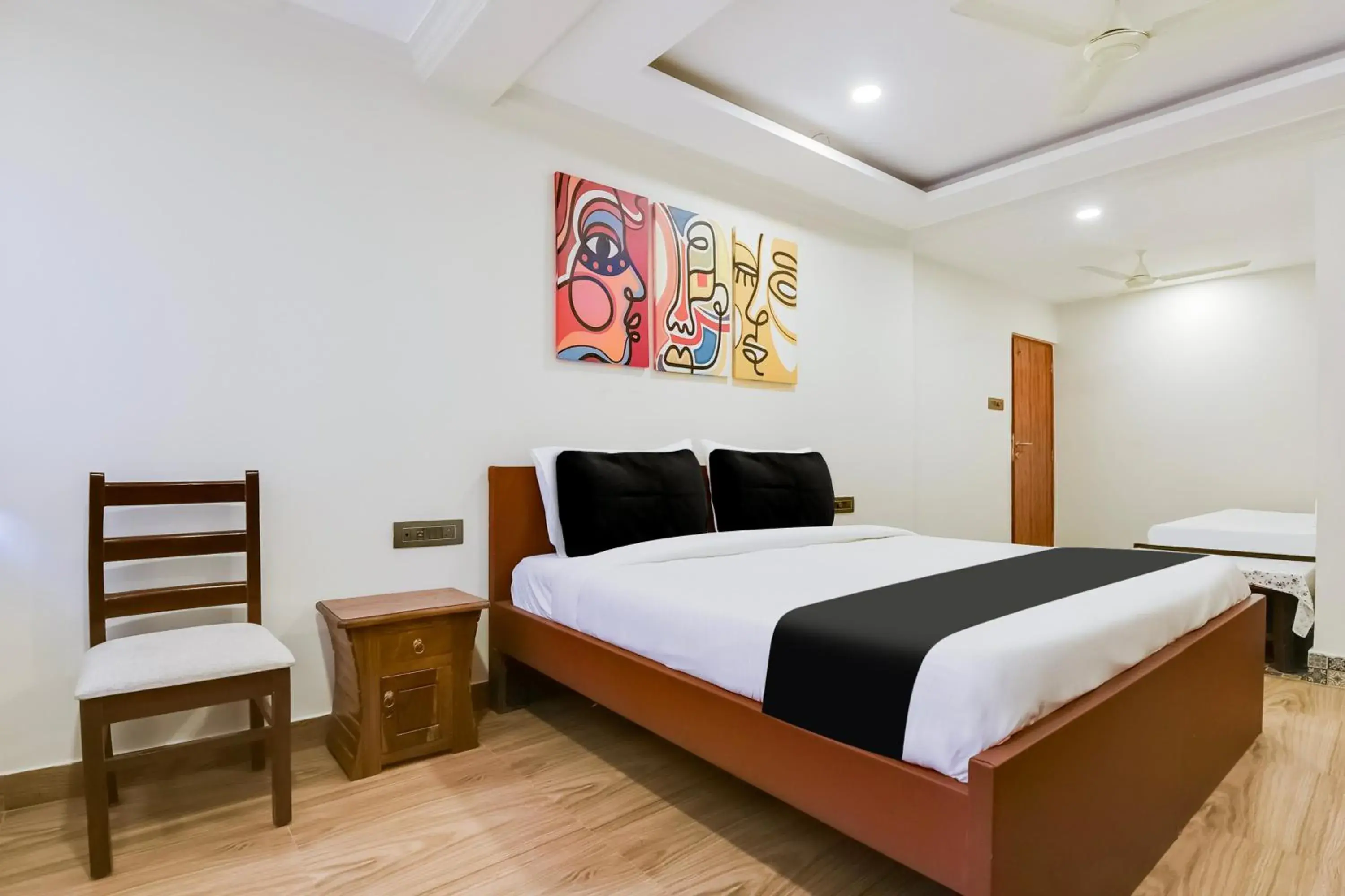 Bedroom, Bed in Super Hotel O Dabolim Near Goa International Airport Bedroom, Bed in Super Hotel O Dabolim Near Goa International Airport