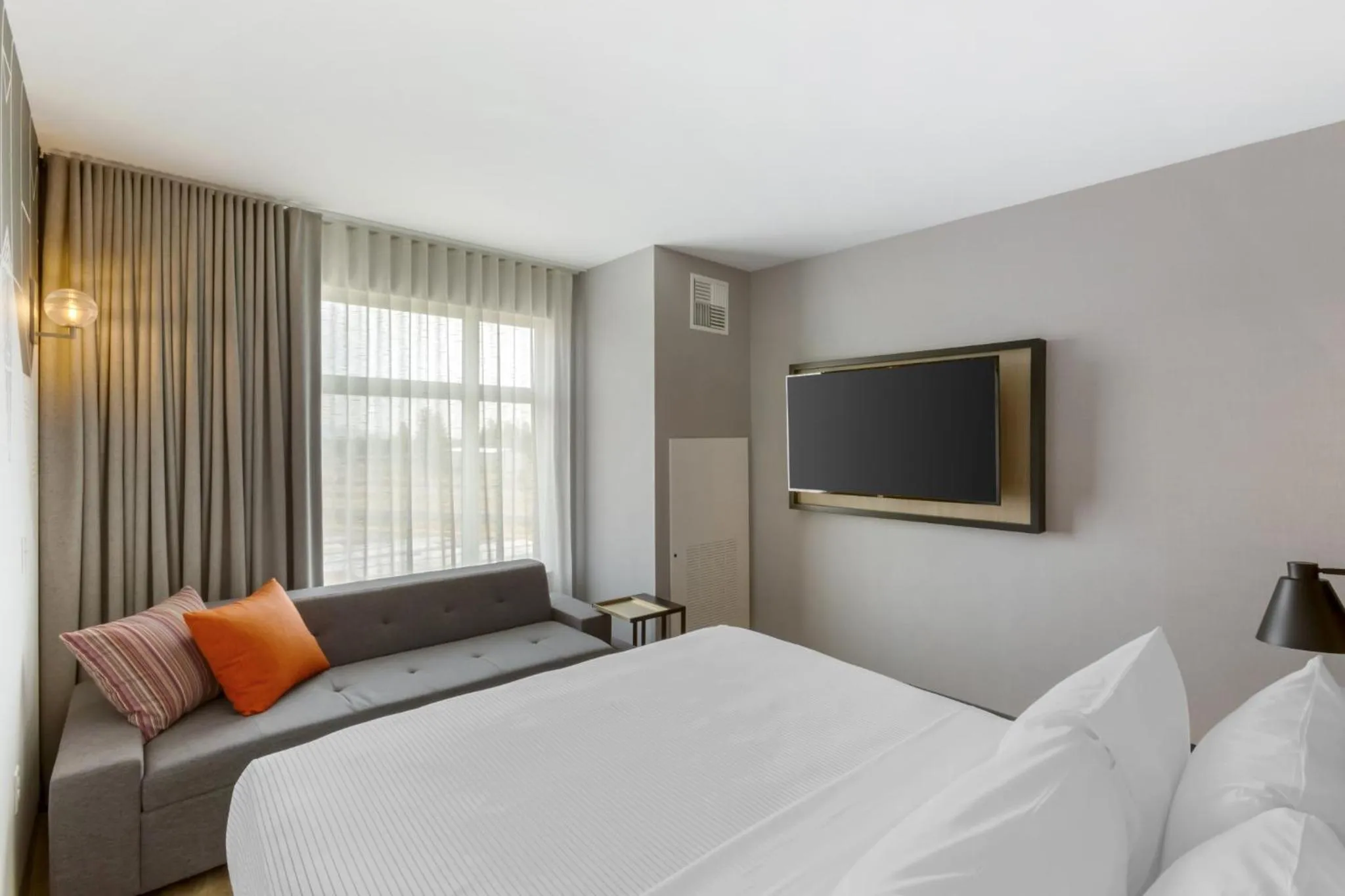 Seating area, Bed in Cambria Hotel Spokane Airport