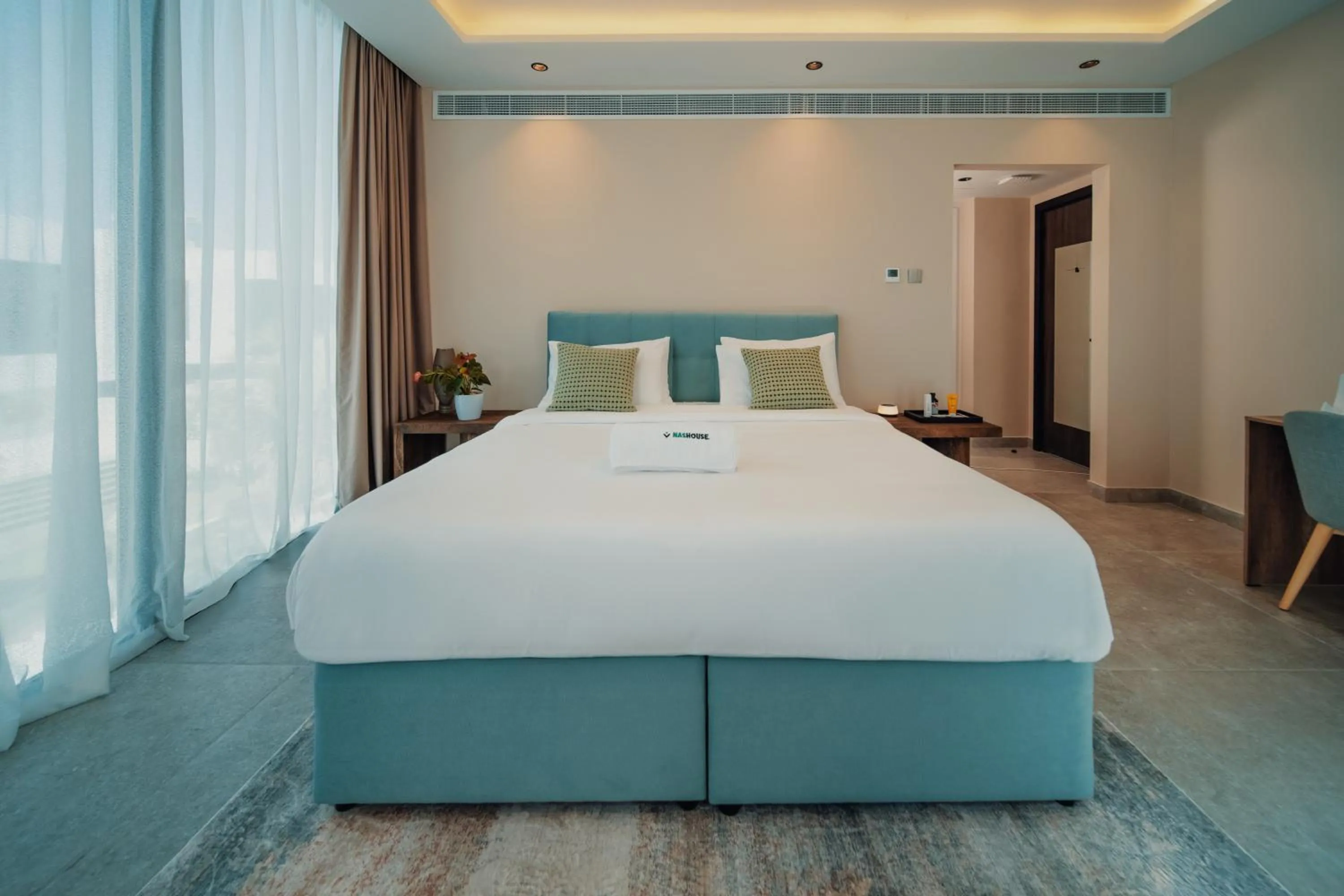 Bed in Nas House Private & Shared Villas