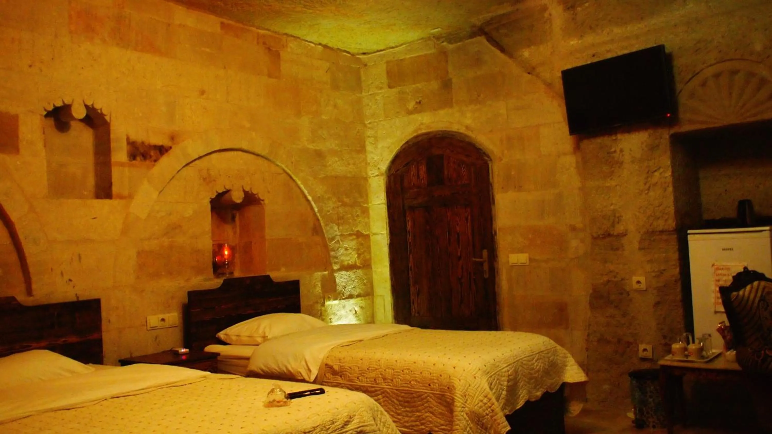 Bed in Family Cave Suite Hotel