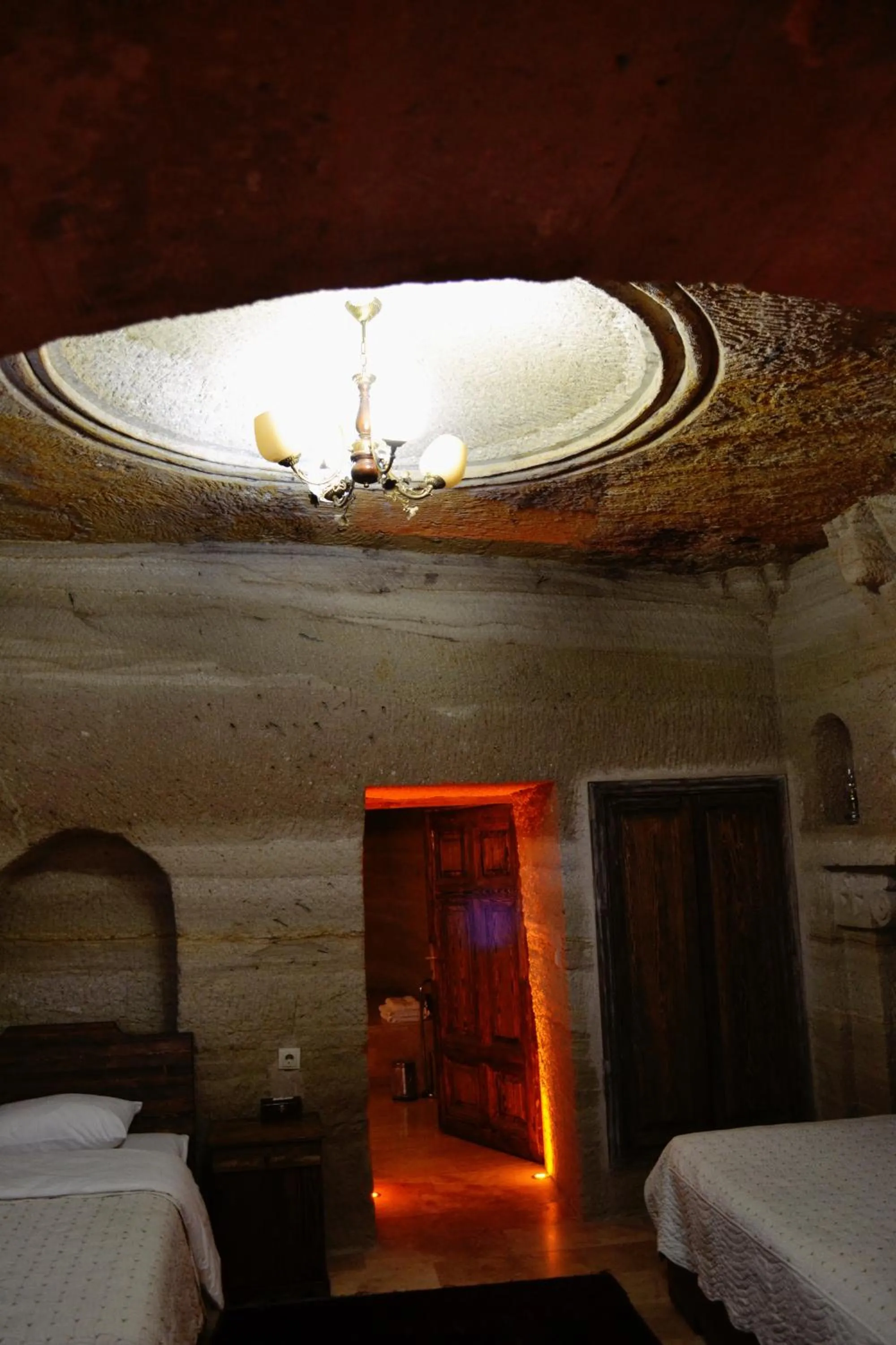 Bed in Family Cave Suite Hotel