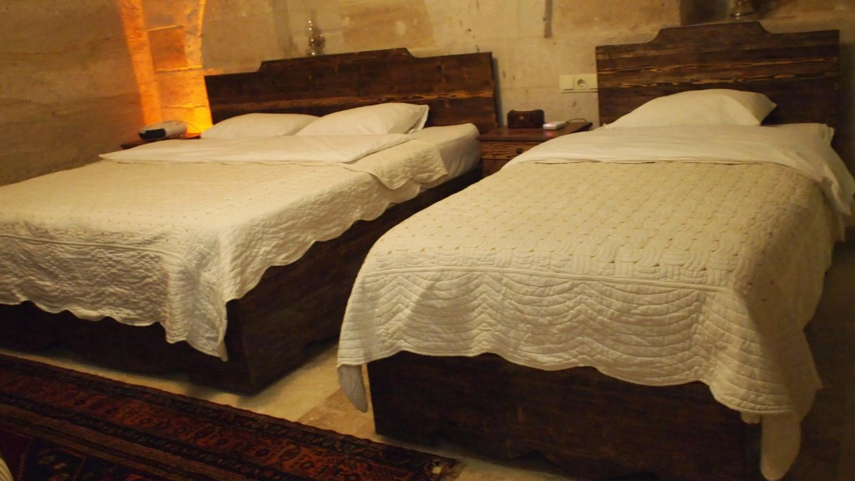 Bed in Family Cave Suite Hotel