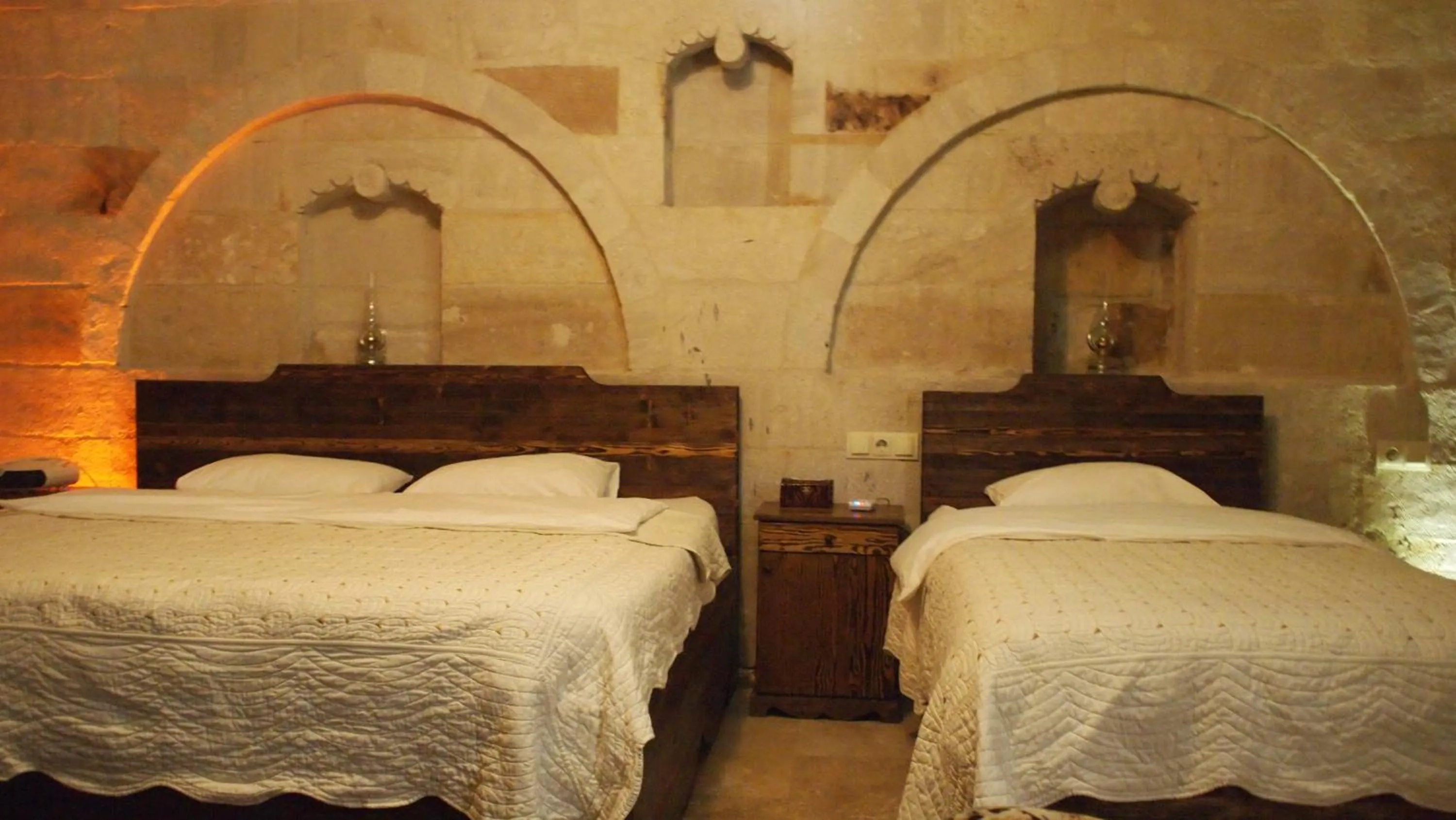 Bed in Family Cave Suite Hotel