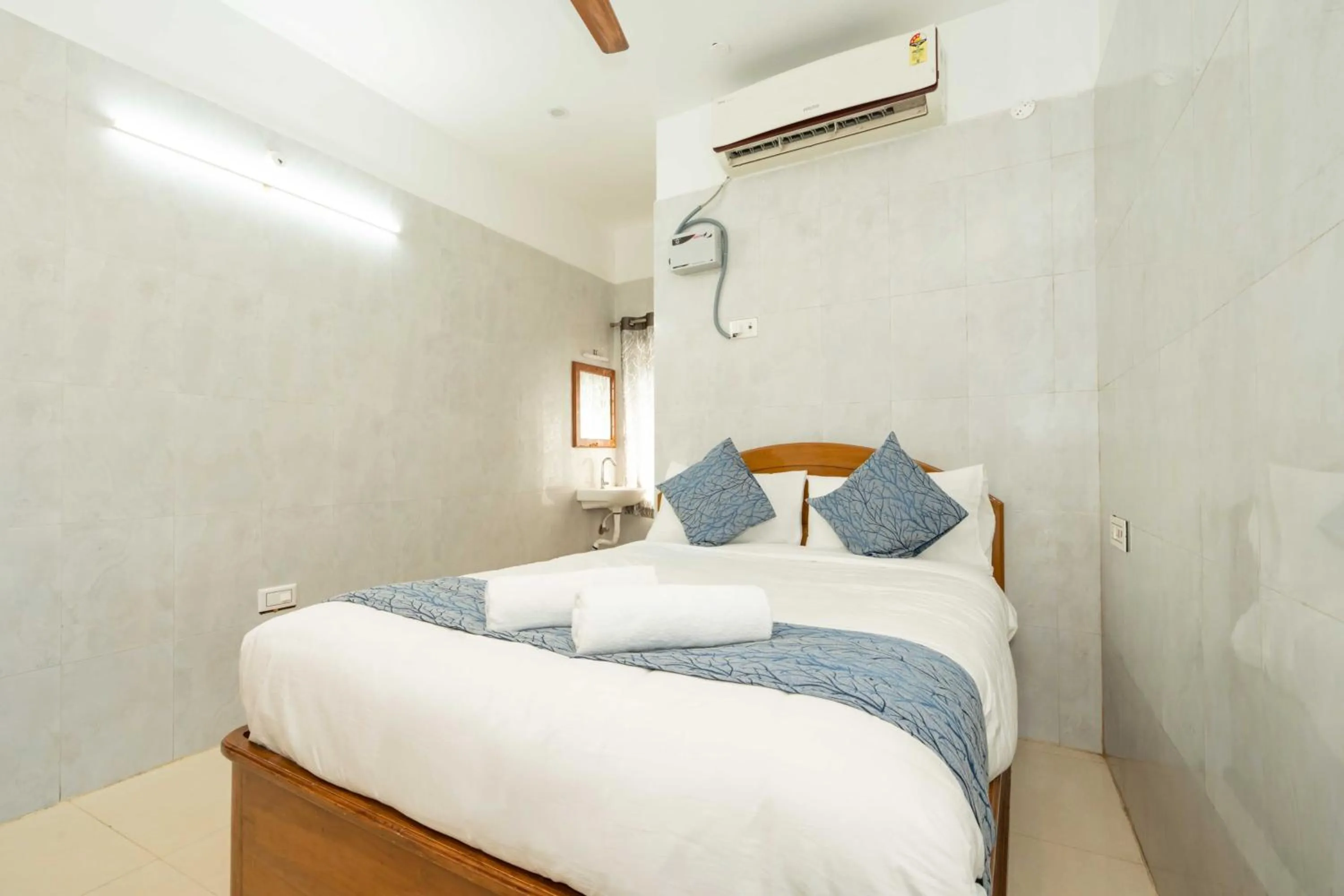 Bed in Hotel Arya Grand Rameswaram by Nimalan