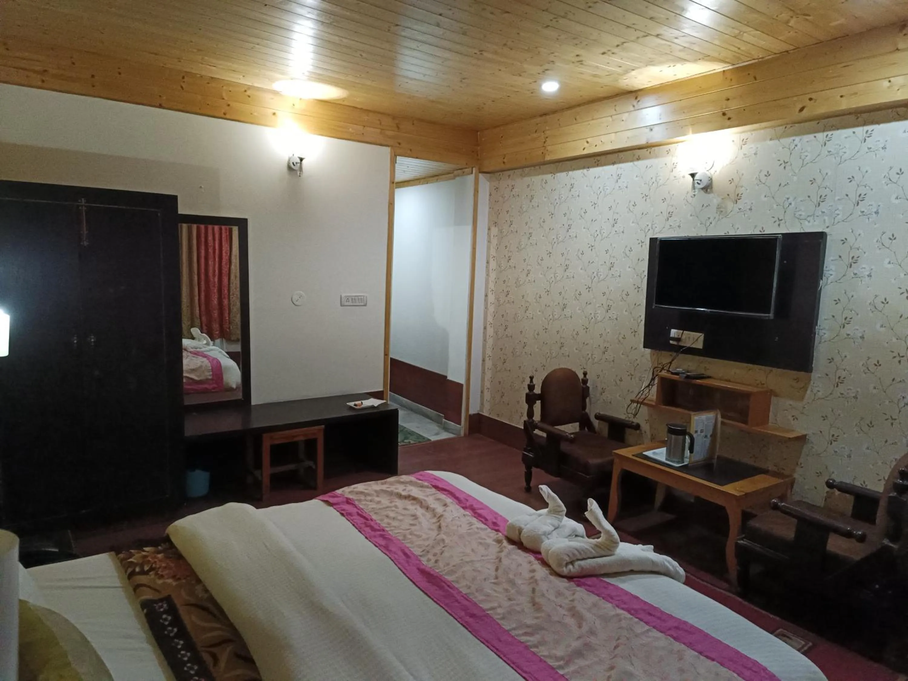 Bed in CS Shhandella Hotel