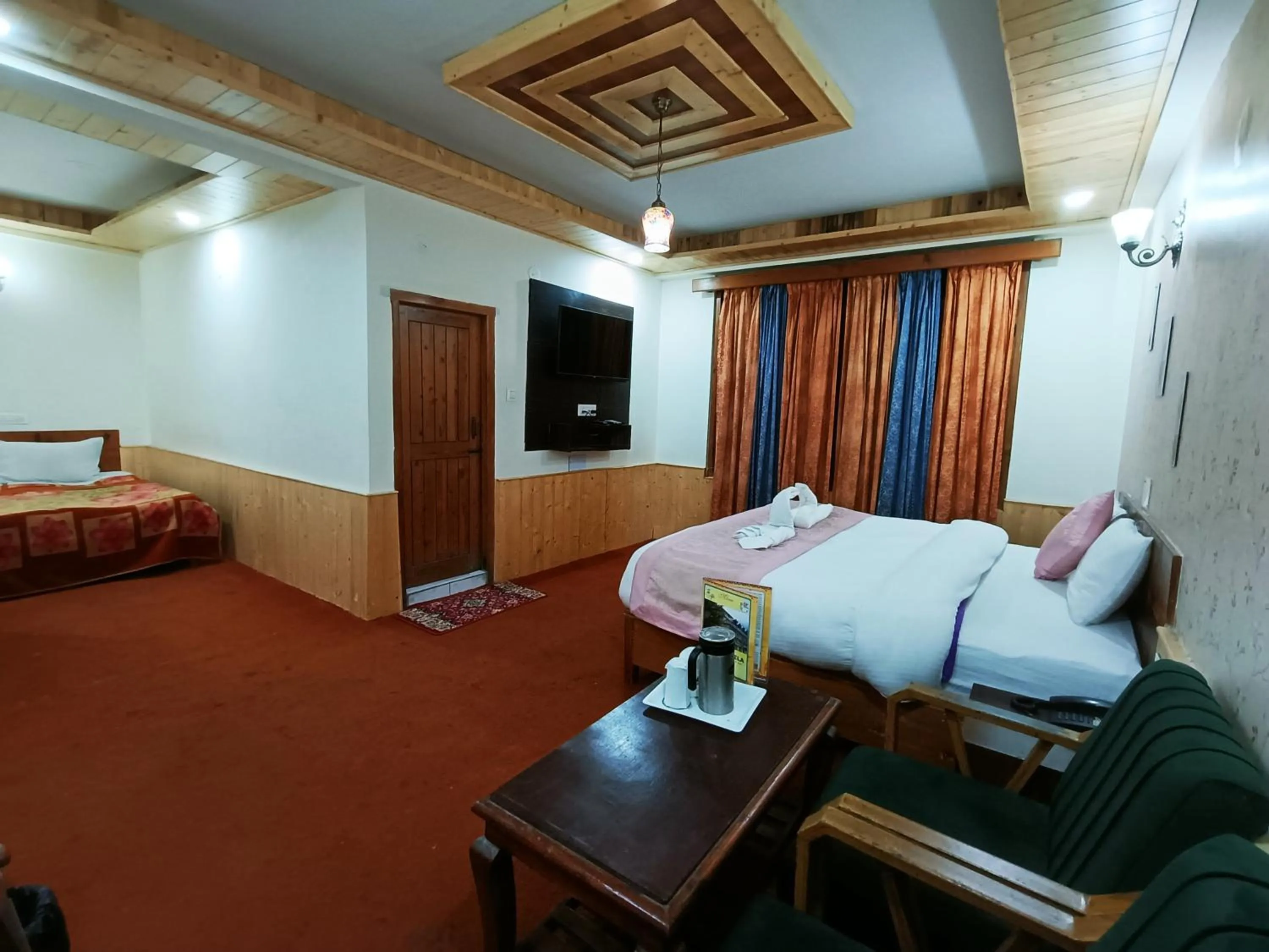 Bed in CS Shhandella Hotel