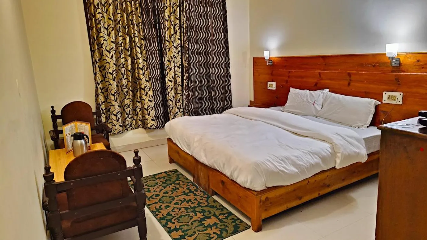 Bed in CS Shhandella Hotel