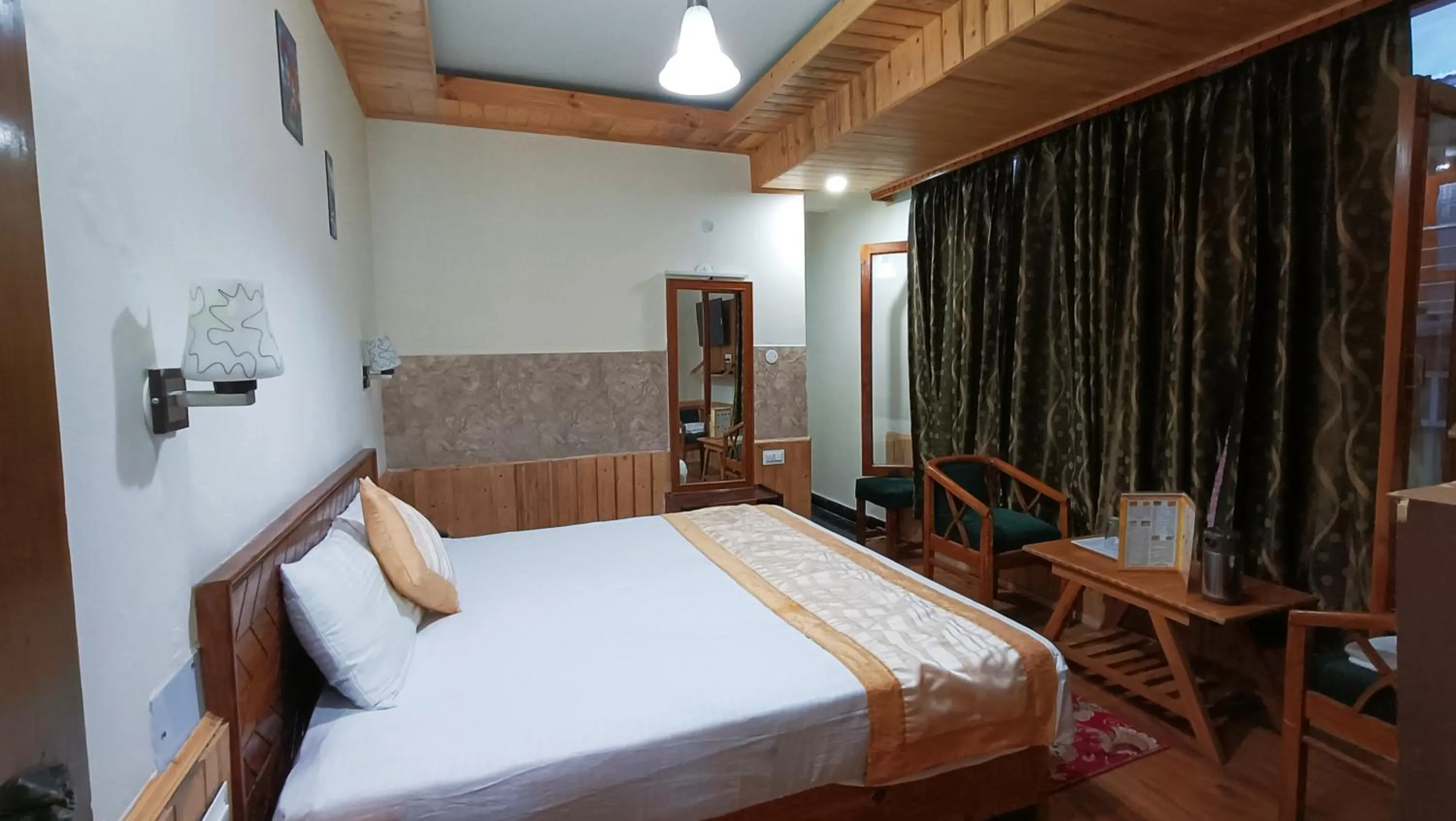 Bed in CS Shhandella Hotel