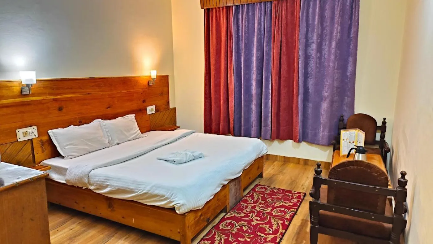 Bed in CS Shhandella Hotel