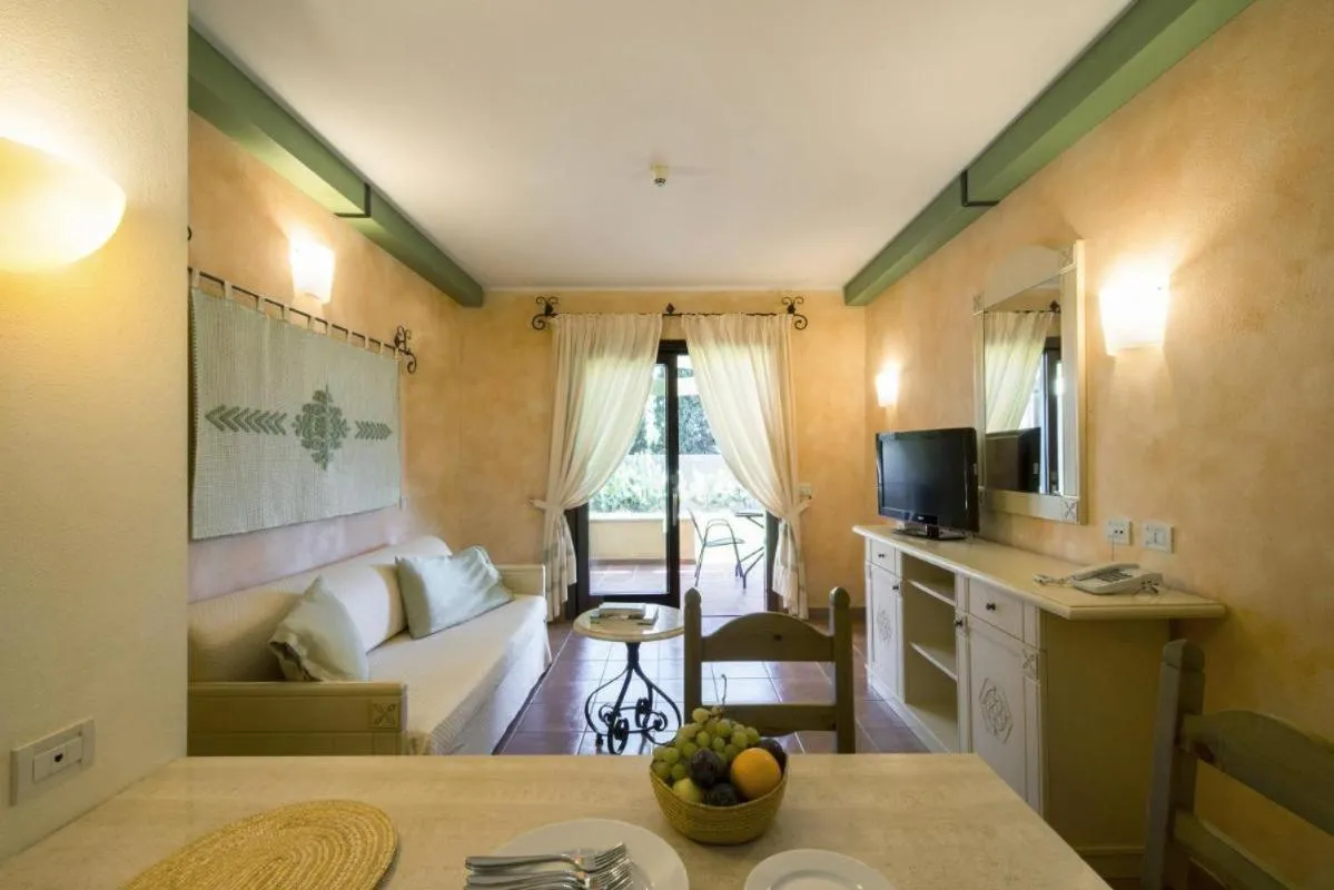 Living room, Bed in Tranquil Lantana Resort Hotel and Apartments 1 Bedroom room apartment sleeps 5