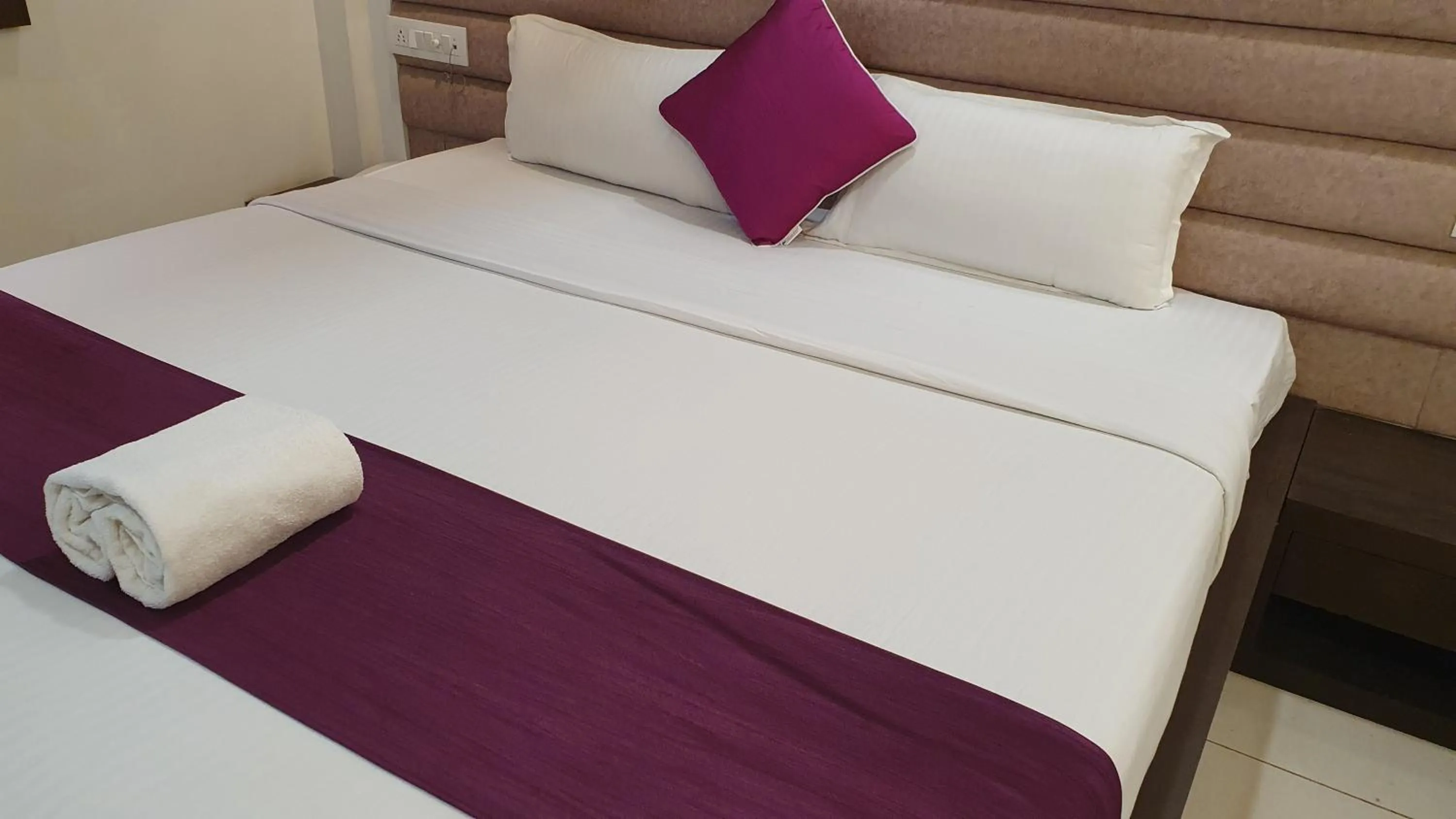 Bed in Hotel Siddhali Inn