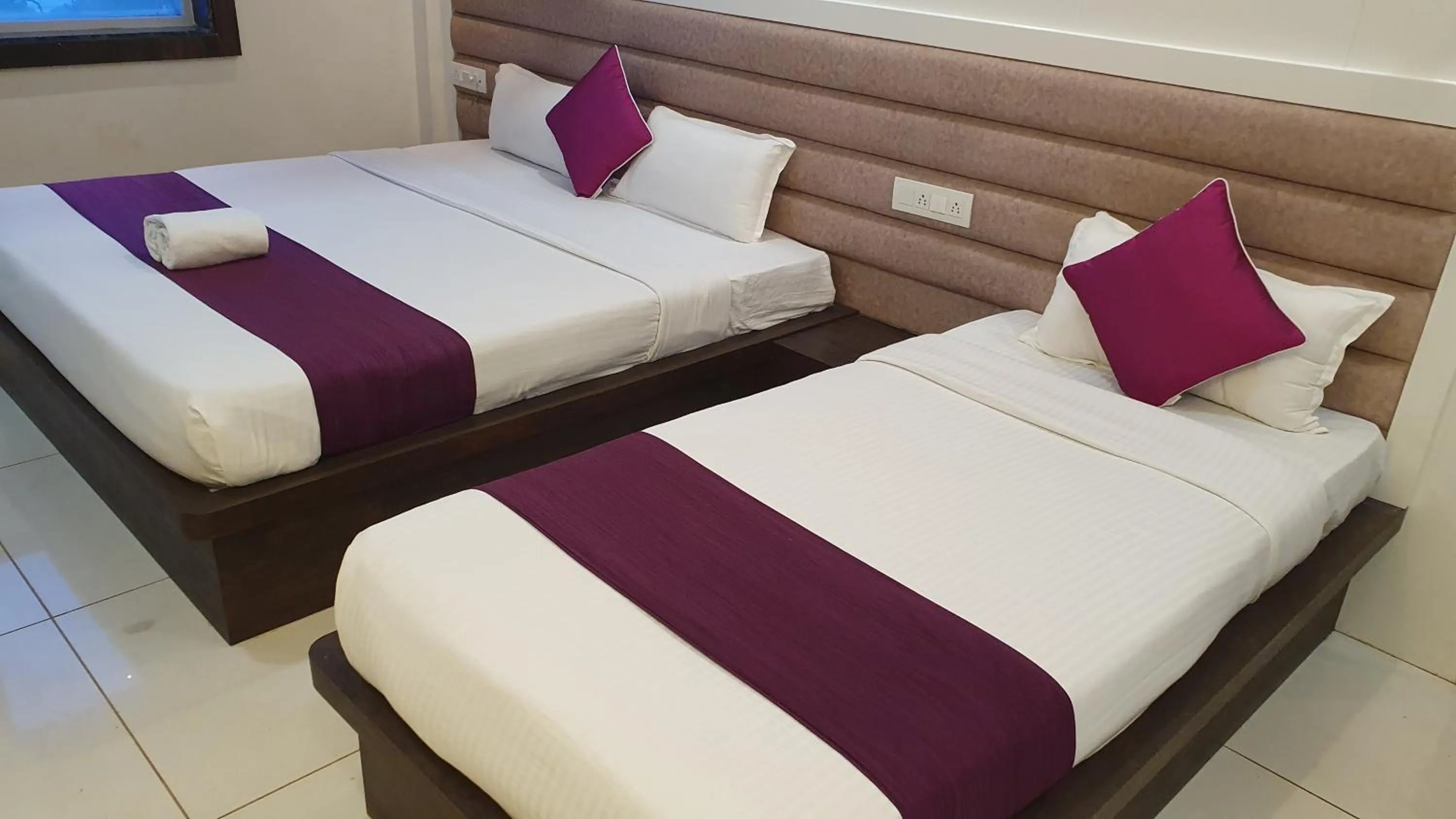 Bed in Hotel Siddhali Inn