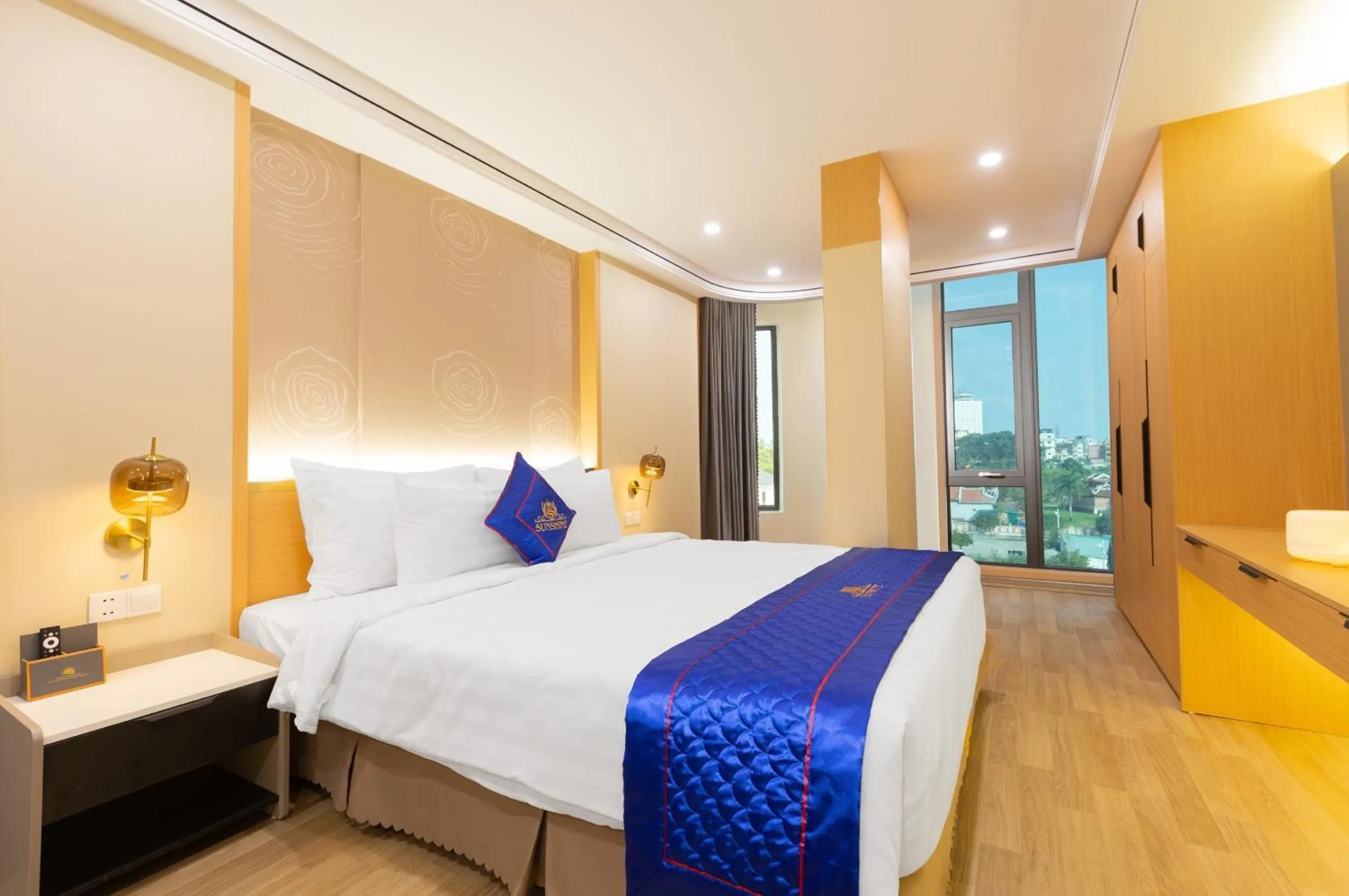 Bed in Sunshine Apartment Hotel