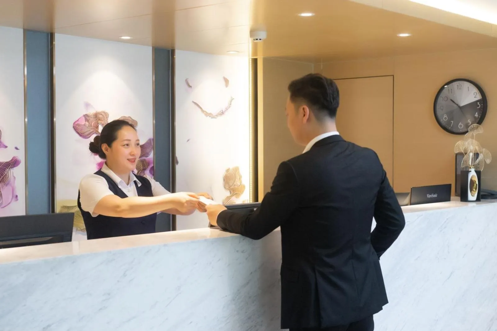 Staff in Guangzhou Baiyun Airport Yunzhi Hotel near Terminal One - Complimentary Shuttle Bus between hotel to Canton Fair Complex during Canton Fair
