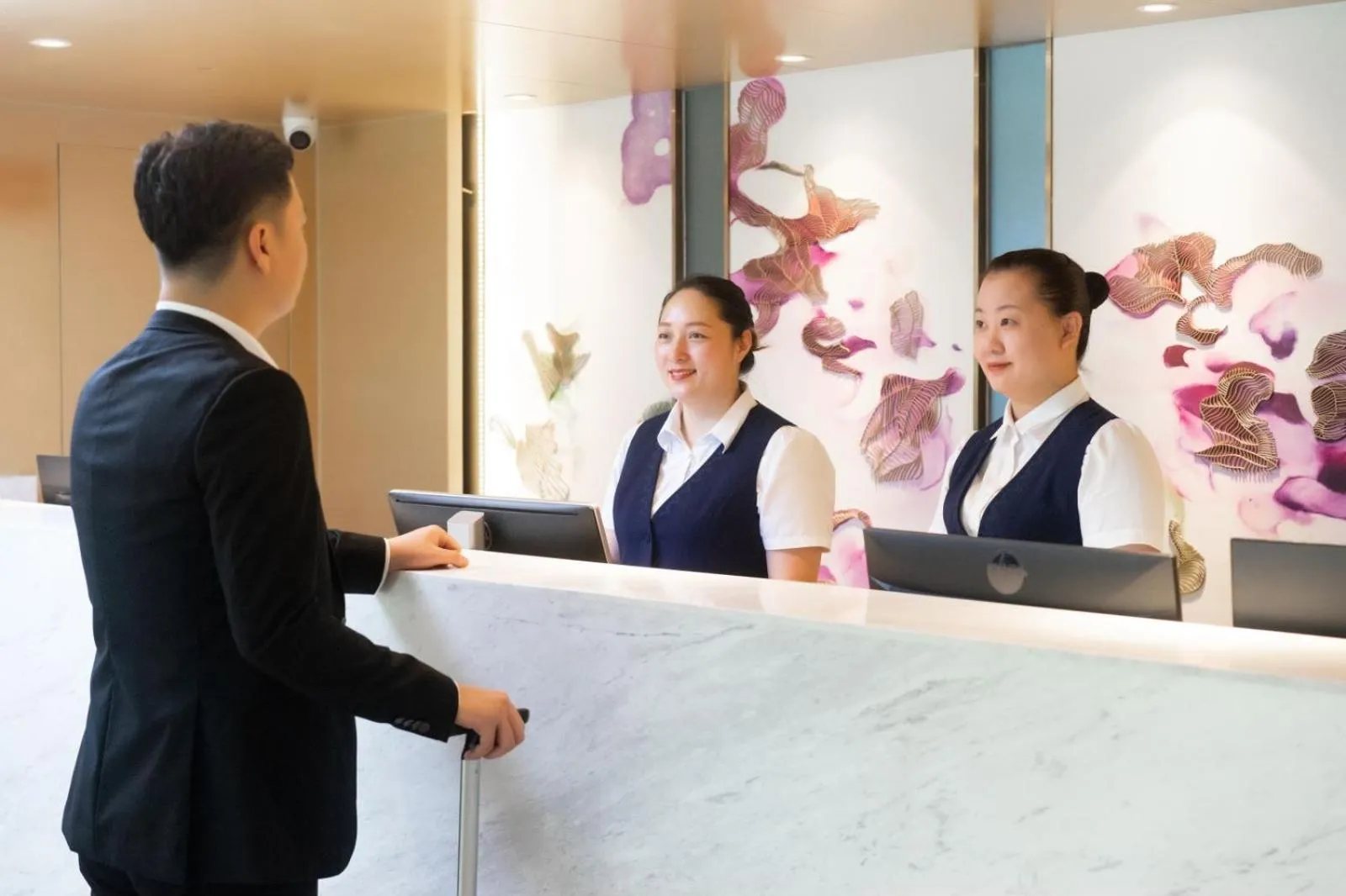 Staff in Guangzhou Baiyun Airport Yunzhi Hotel near Terminal One - Complimentary Shuttle Bus between hotel to Canton Fair Complex during Canton Fair