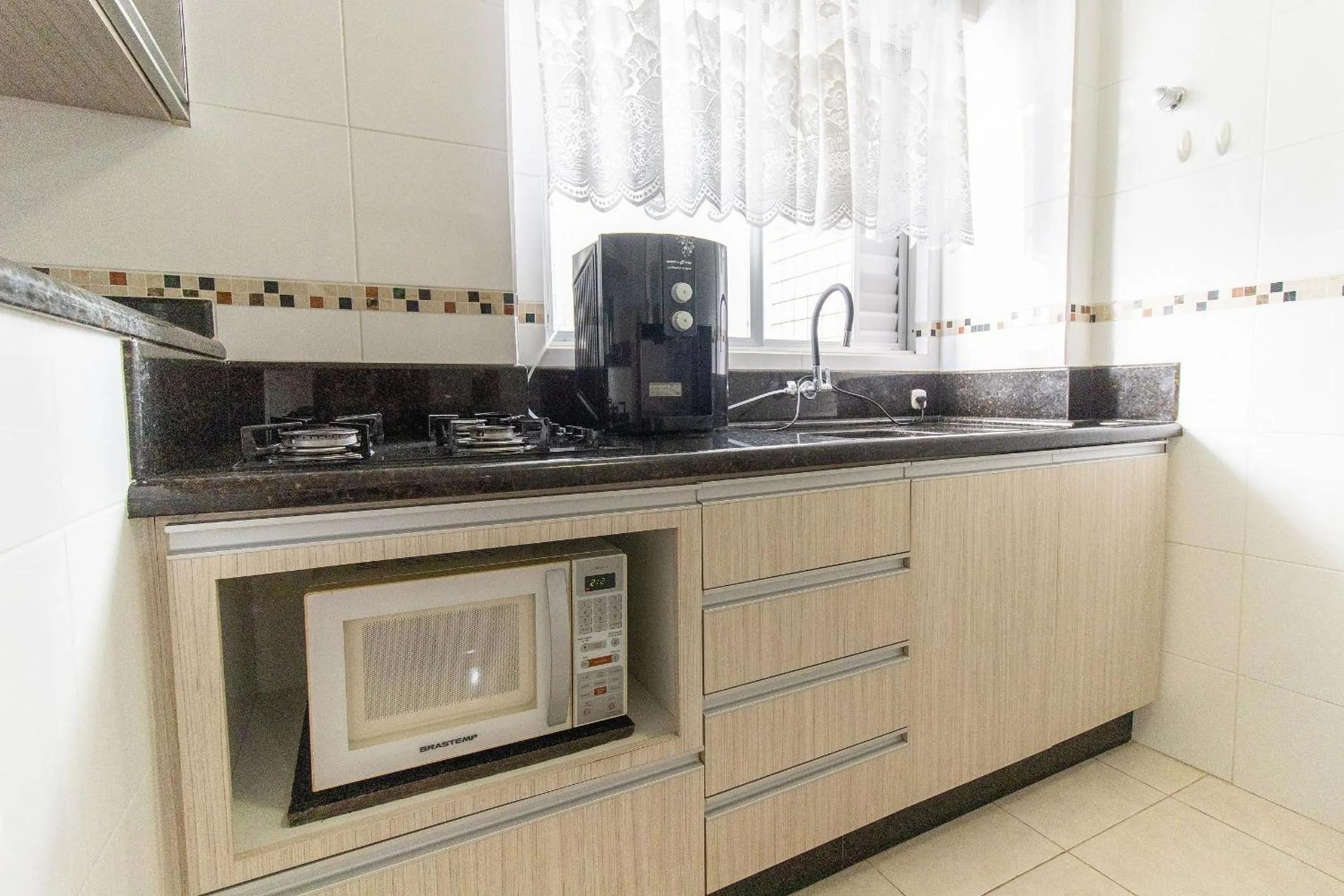Kitchen or kitchenette in VNZ42B - Climatizado, Quadra Mar, Garagem, Wi-Fi