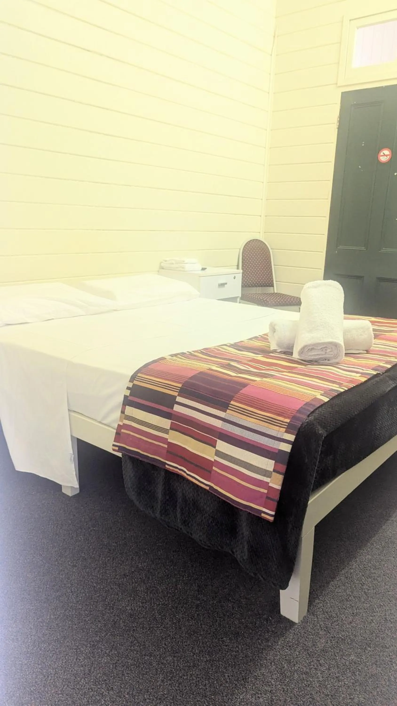 Bed in GRAND CENTRAL HOTEL PROSERPINE