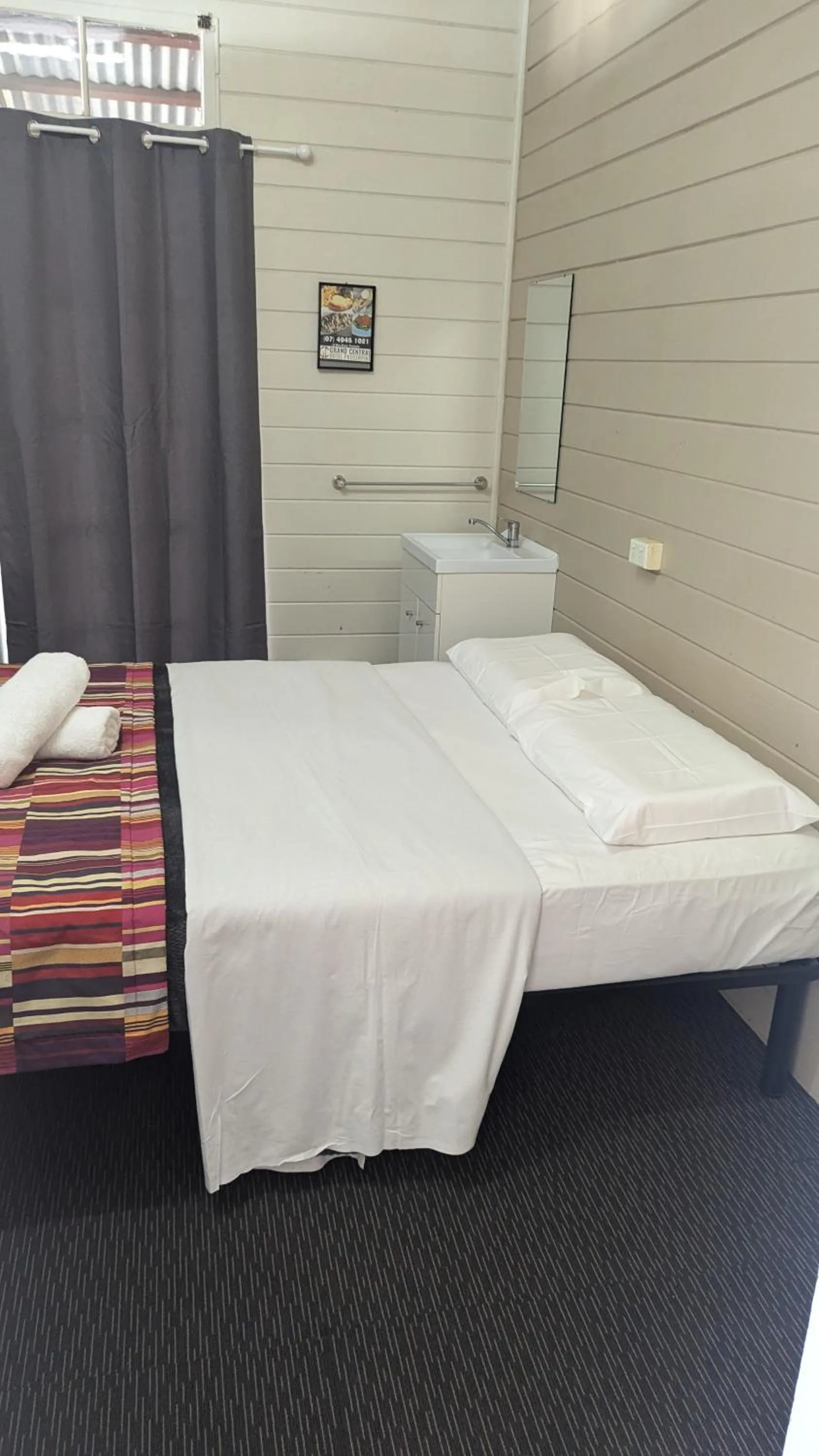 Bed in GRAND CENTRAL HOTEL PROSERPINE
