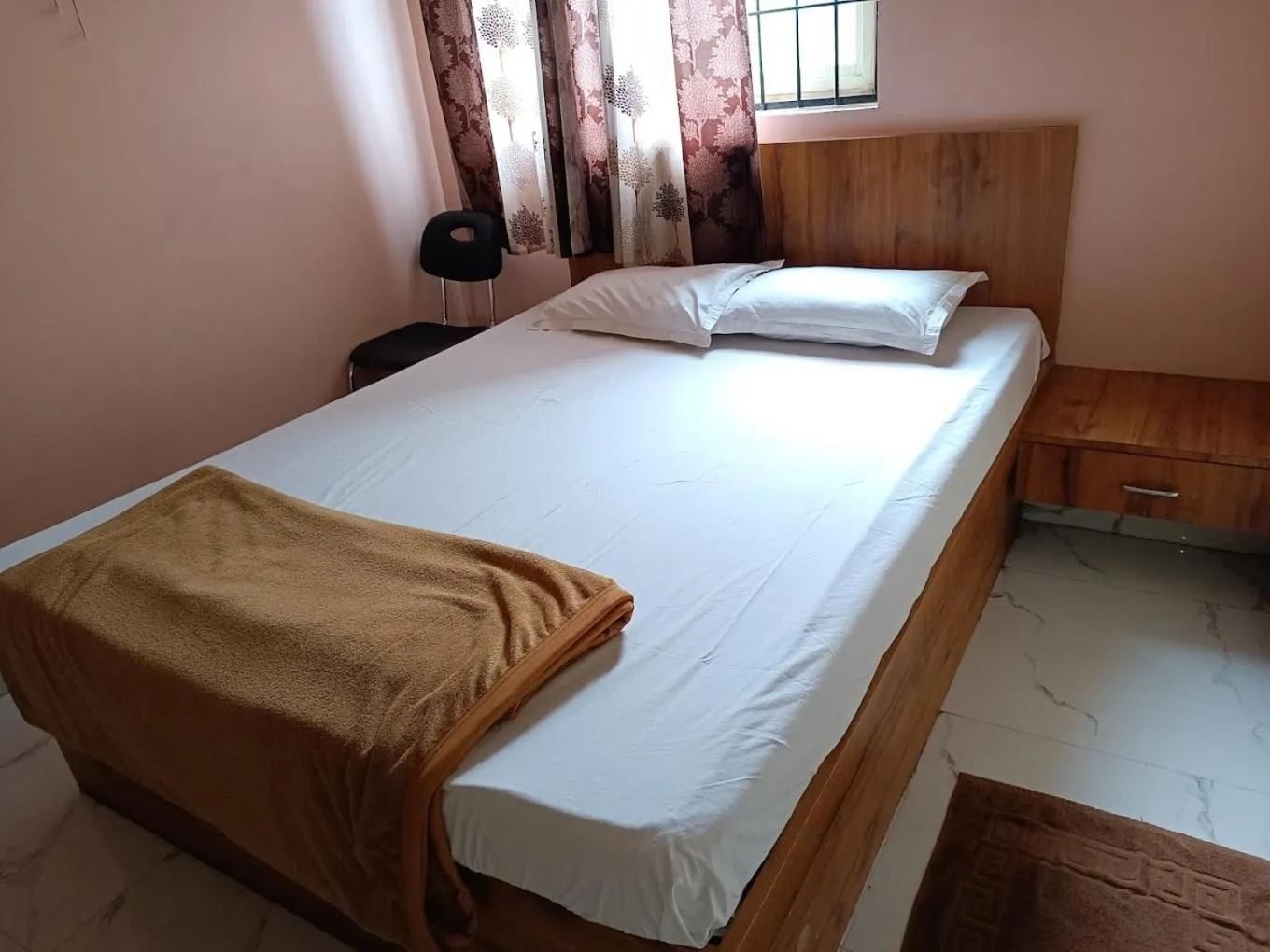 Bed in Mandara Comforts Hotel