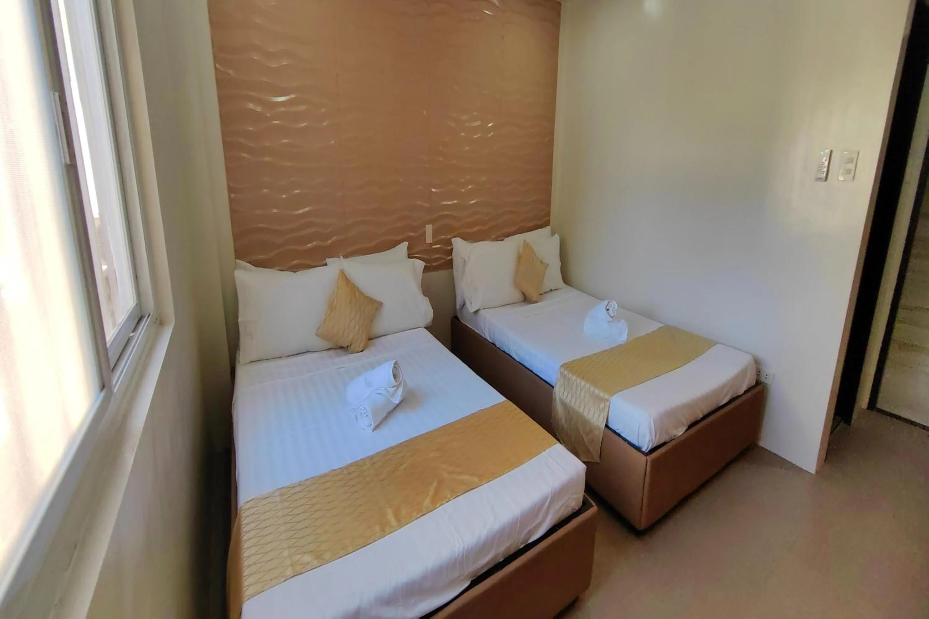 Bed in Manuela Suites Puerto Princesa near Airport