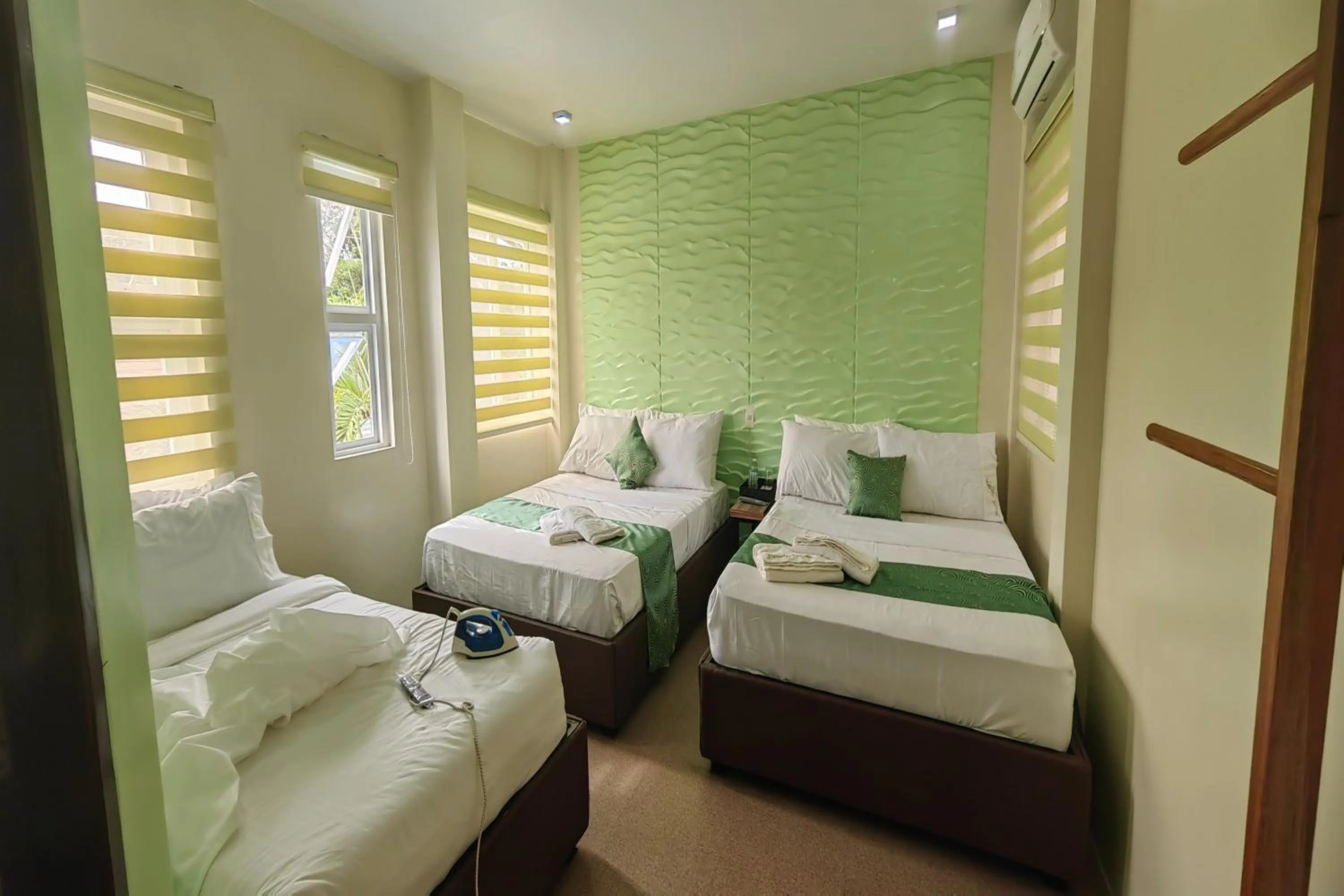 Bed in Manuela Suites Puerto Princesa near Airport
