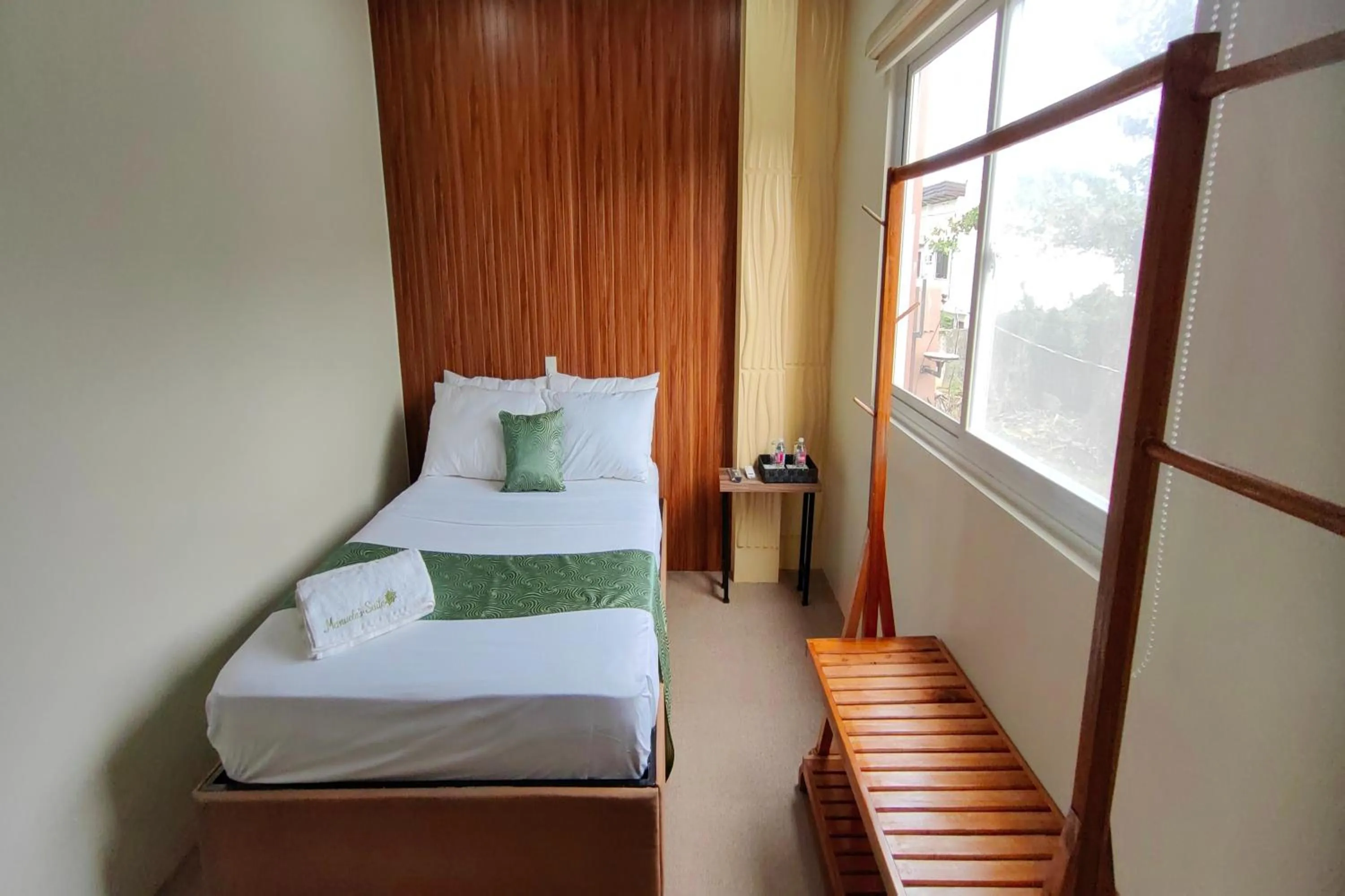 Bed in Manuela Suites Puerto Princesa near Airport