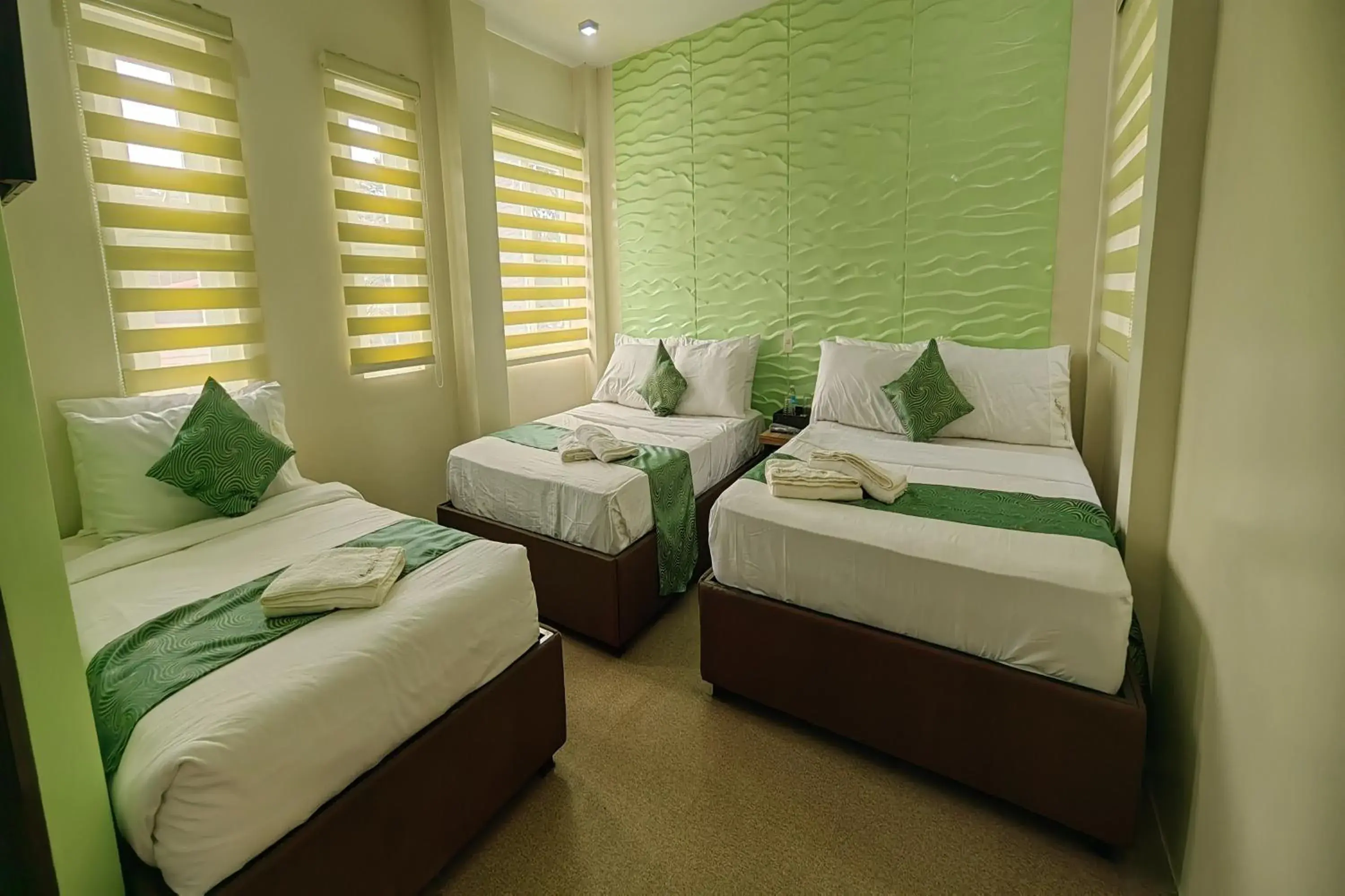 Bed in Manuela Suites Puerto Princesa near Airport Bed in Manuela Suites Puerto Princesa near Airport