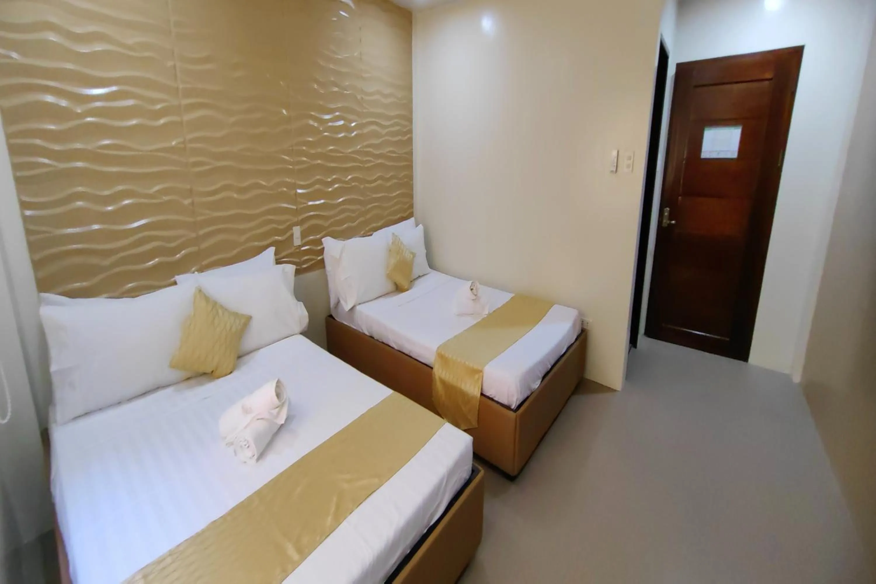 Bed in Manuela Suites Puerto Princesa near Airport