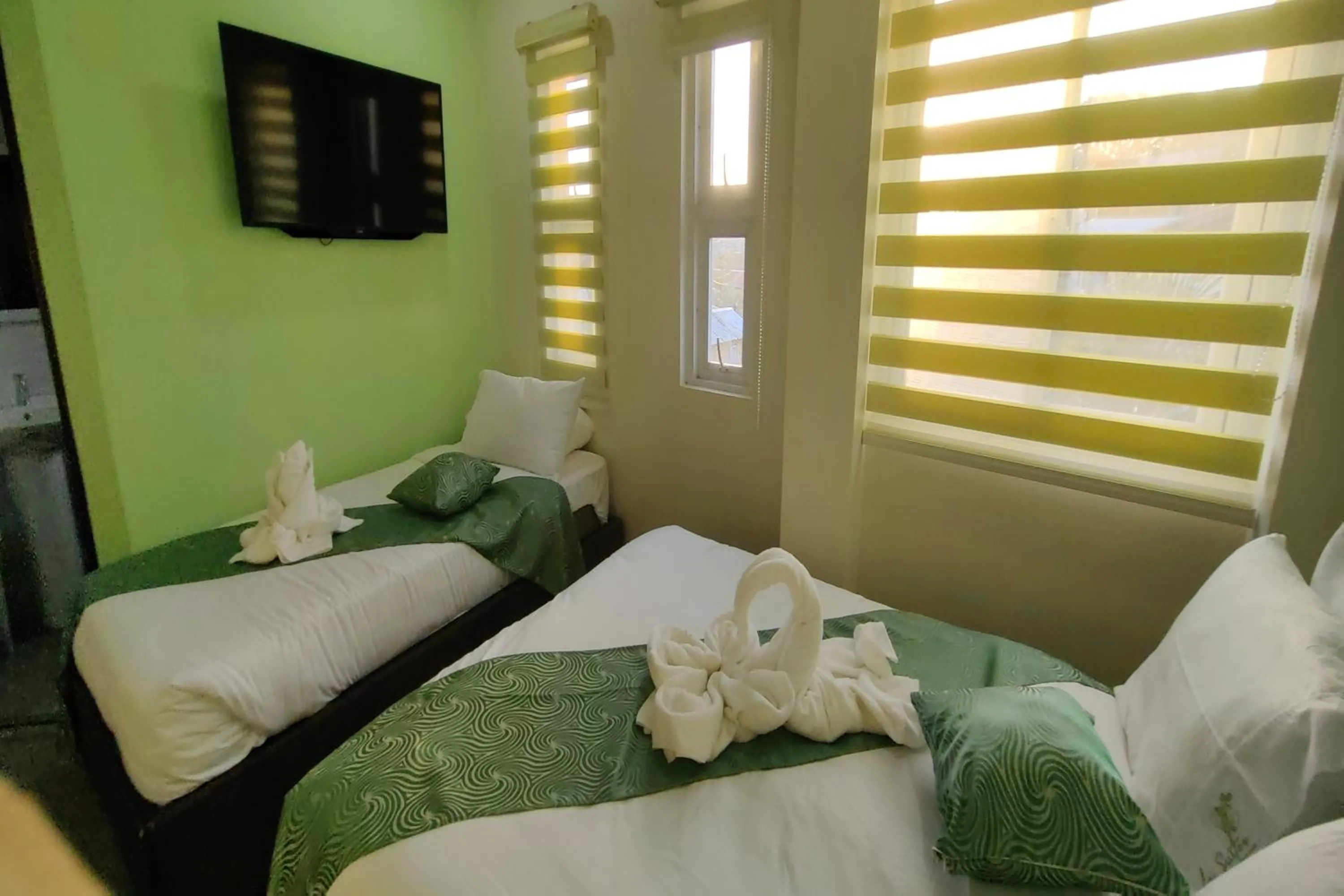 Bed in Manuela Suites Puerto Princesa near Airport