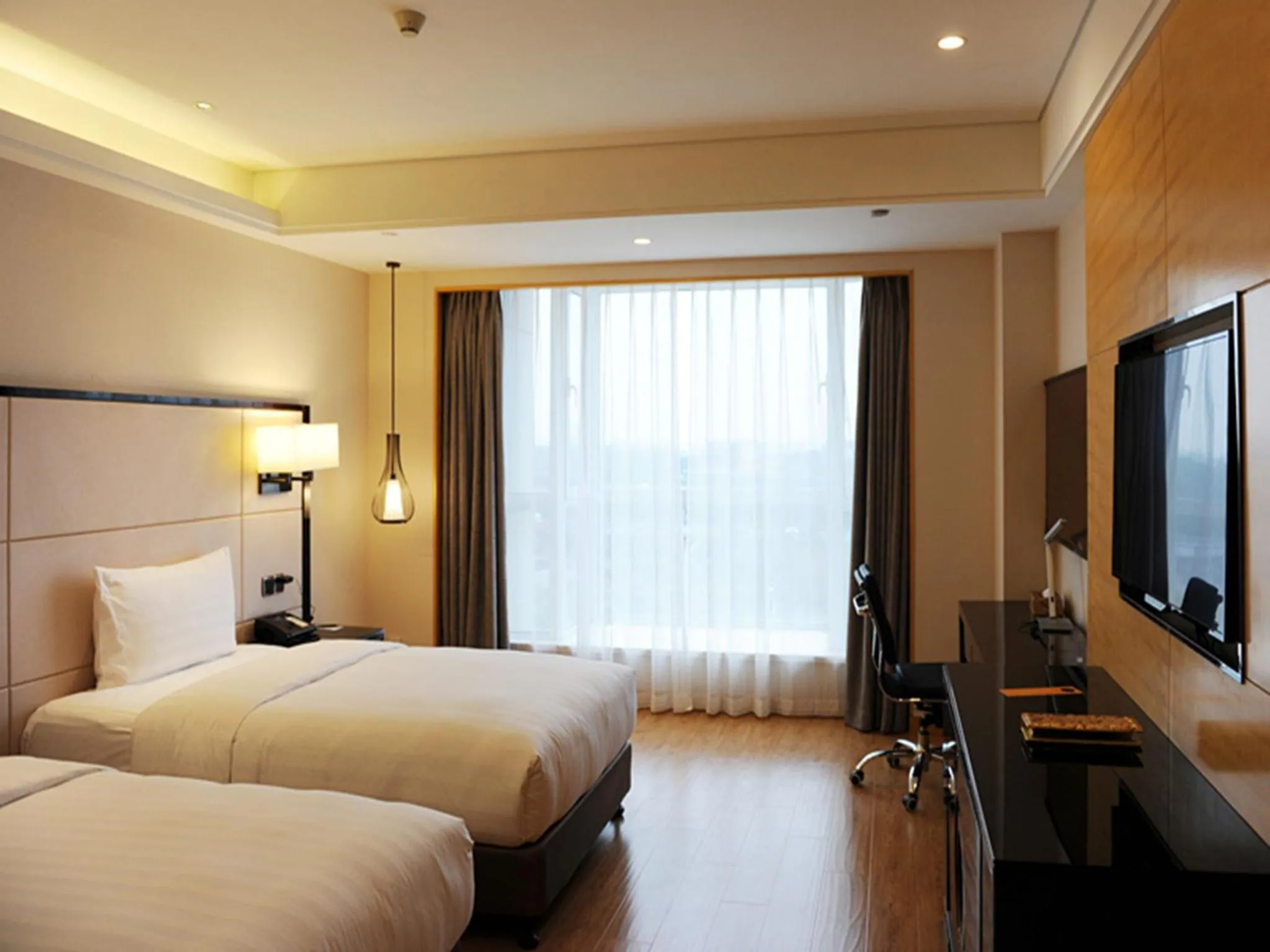 Photo of the whole room in Pullman Qingdao Ziyue