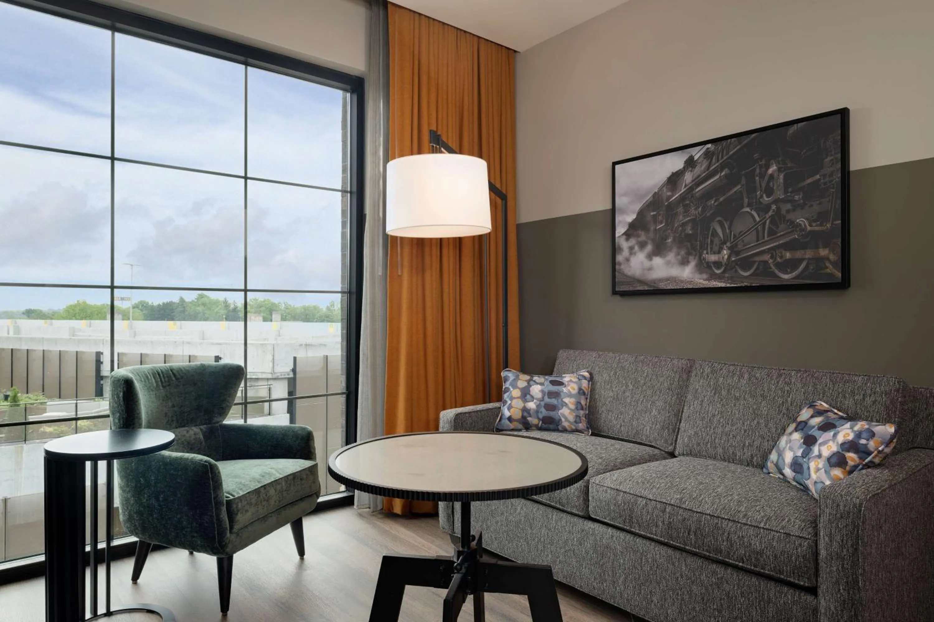 Living room in Hotel Nickel Plate Fishers, Tapestry Collection By Hilton